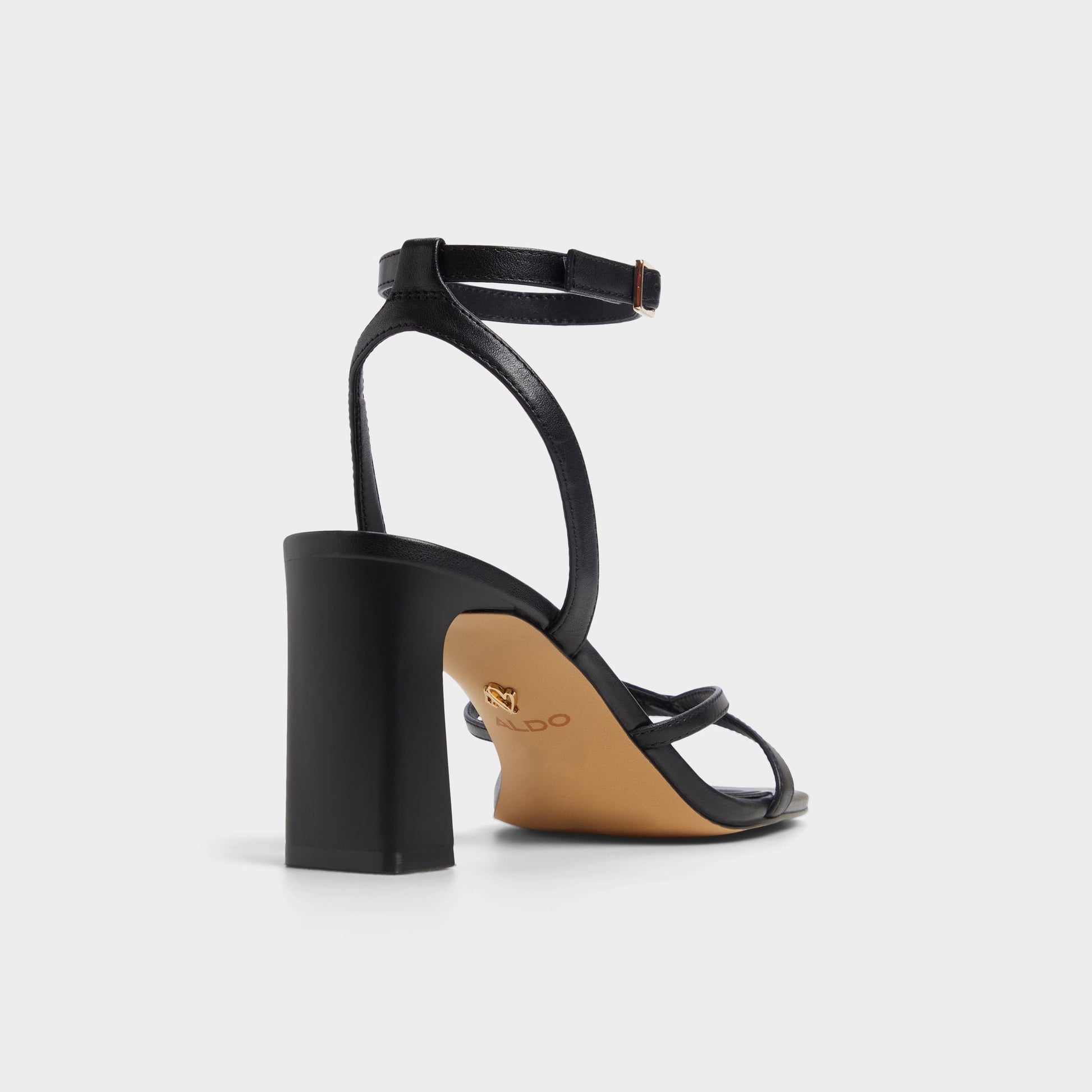 Three-quarter angle of Other Black Stellare Strappy heeled sandal's back side