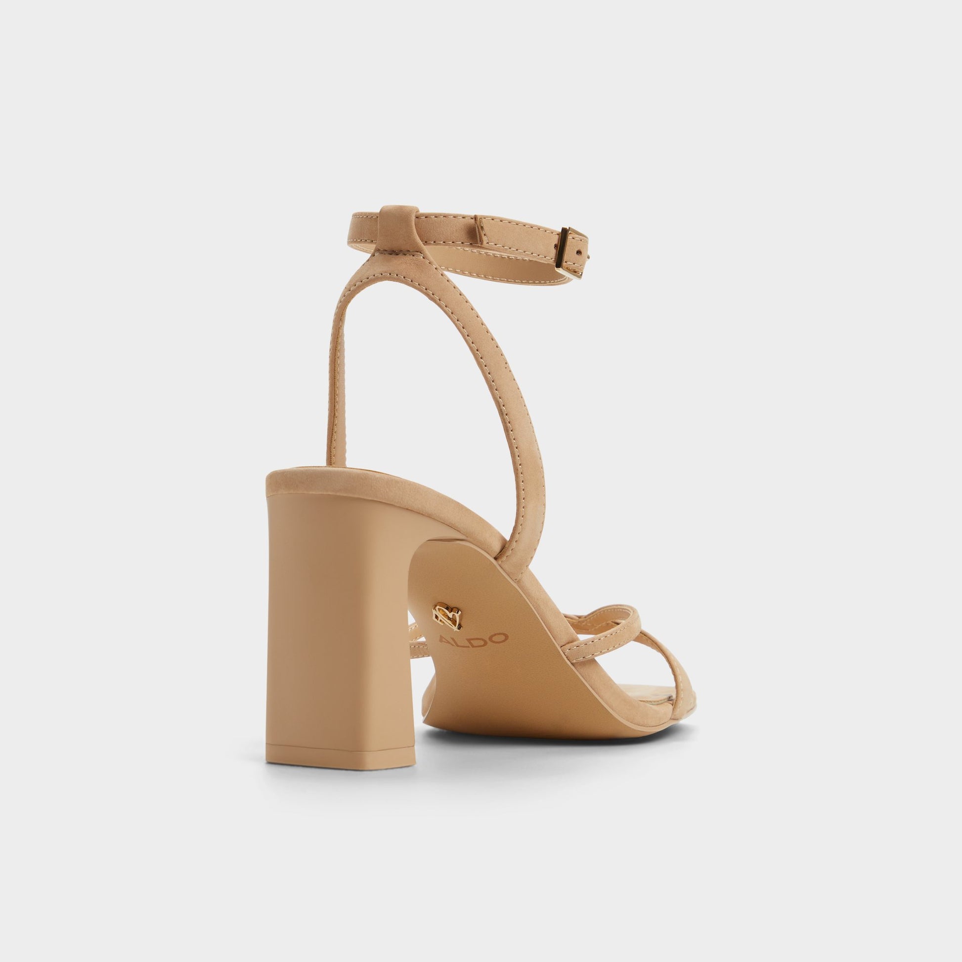 Three-quarter angle of Beige Stellare Strappy heeled sandal's back side