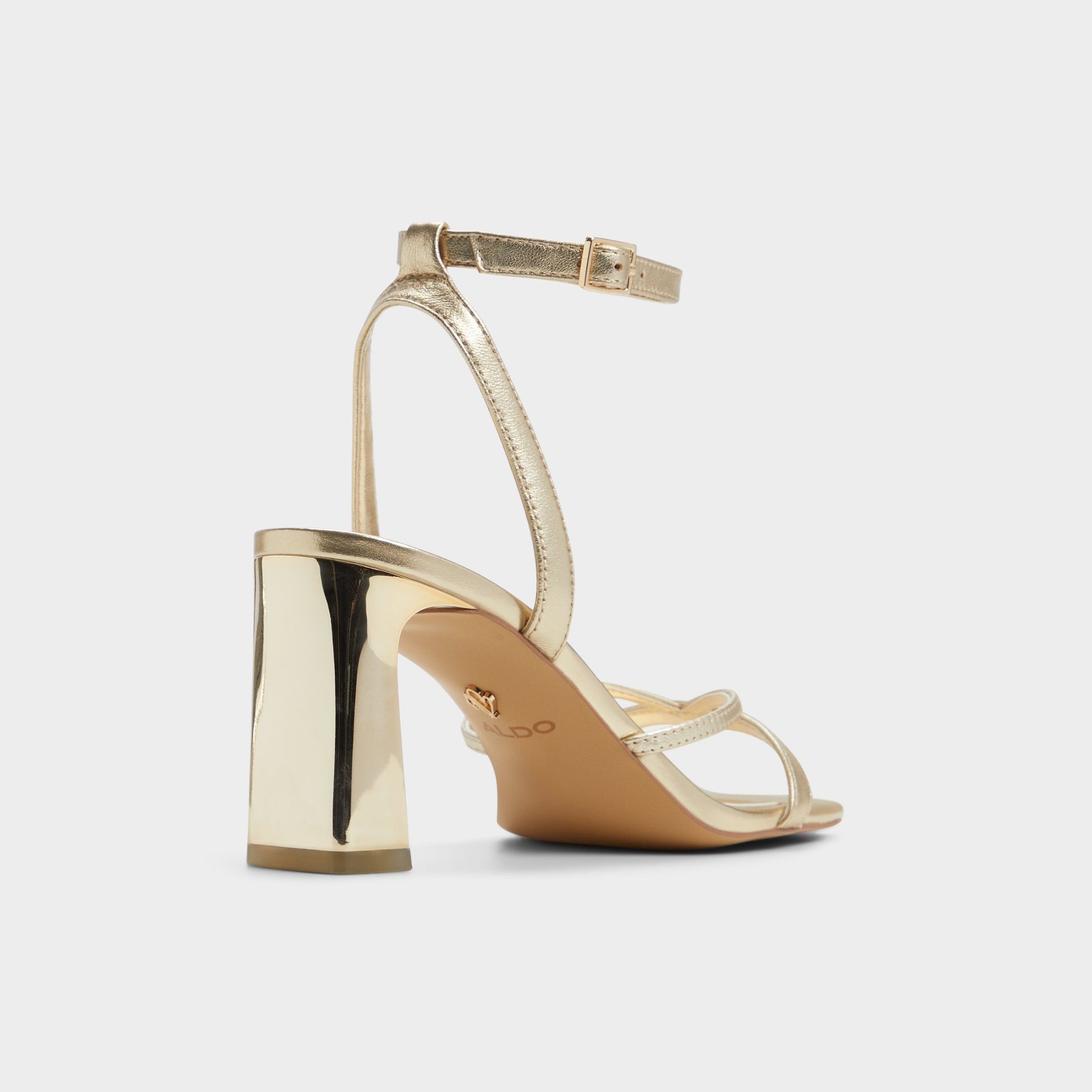 Three-quarter angle of Gold Stellare Strappy heeled sandal's back side