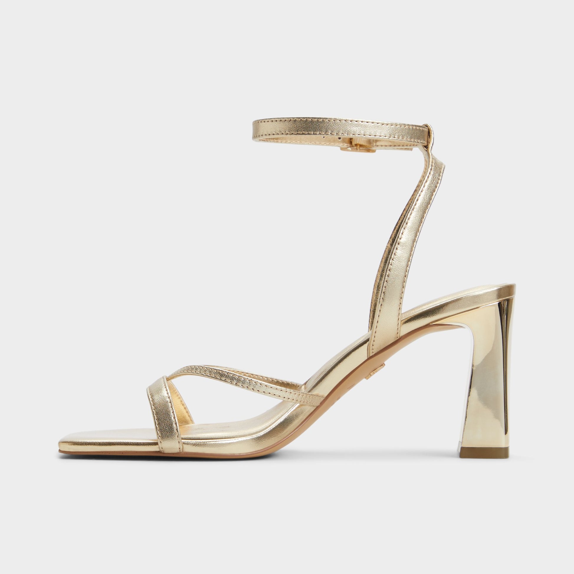 Side view of Gold Stellare Strappy heeled sandal