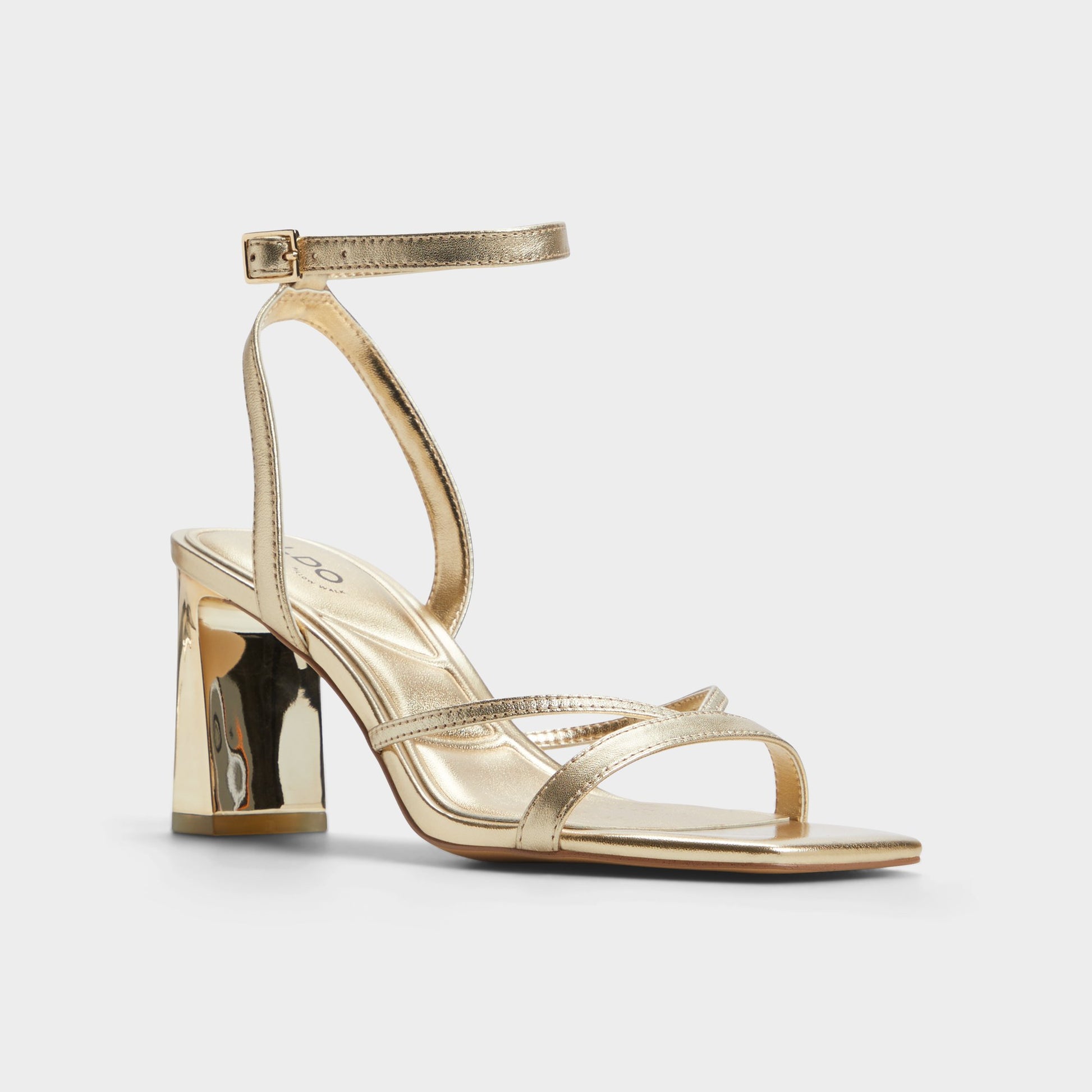 Three-quarter angle of Gold Stellare Strappy heeled sandal's front side