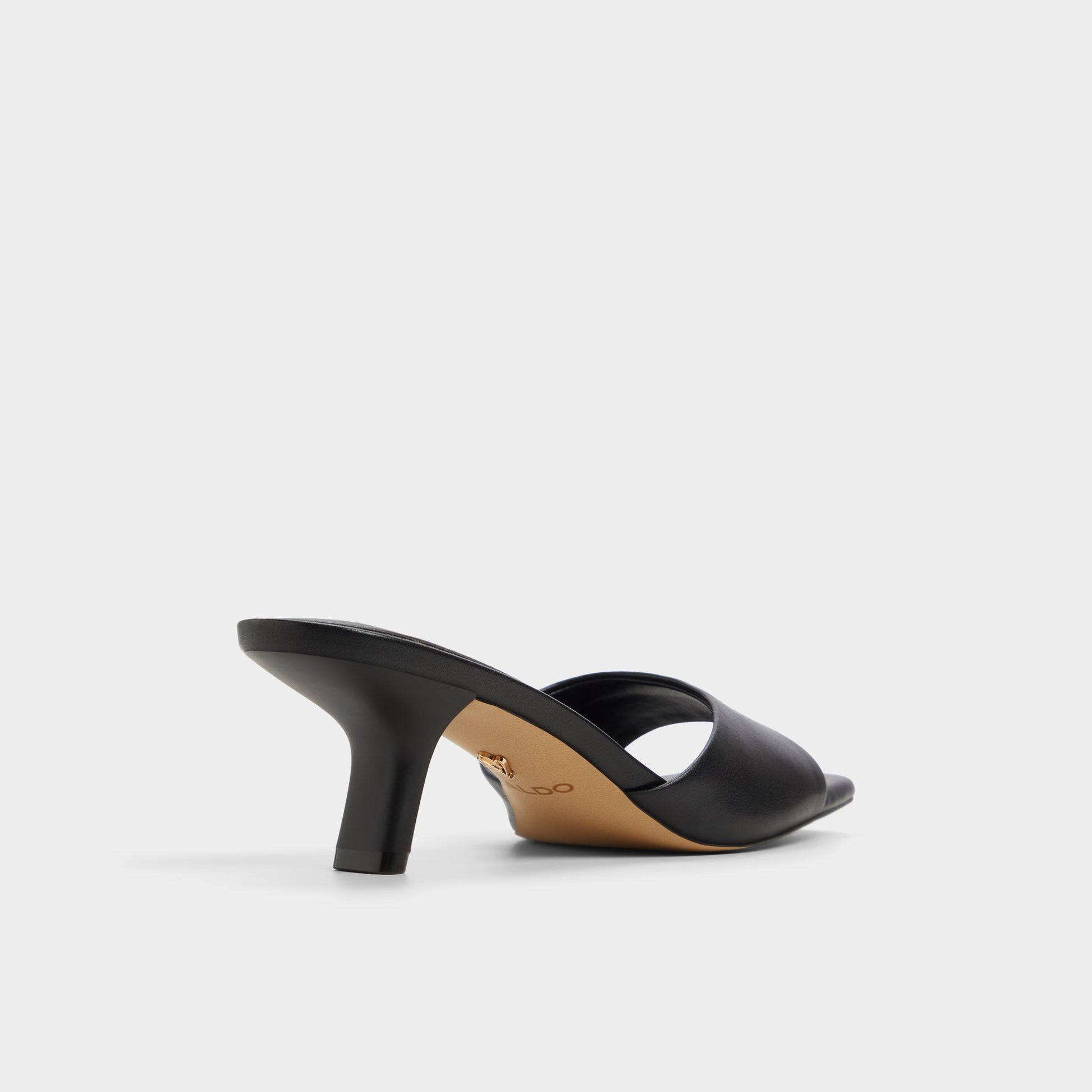 Three-quarter angle of Black Enchanting Heeled mule's back side