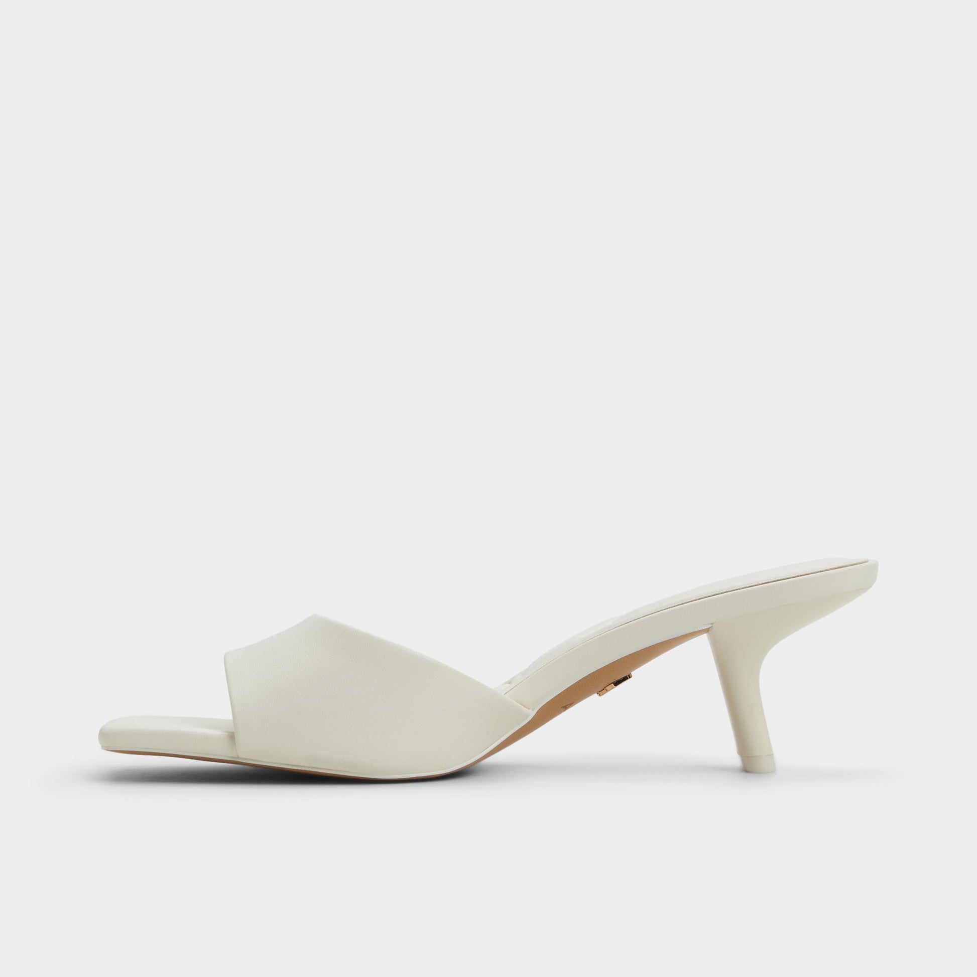 Side view of White Enchanting Heeled mule