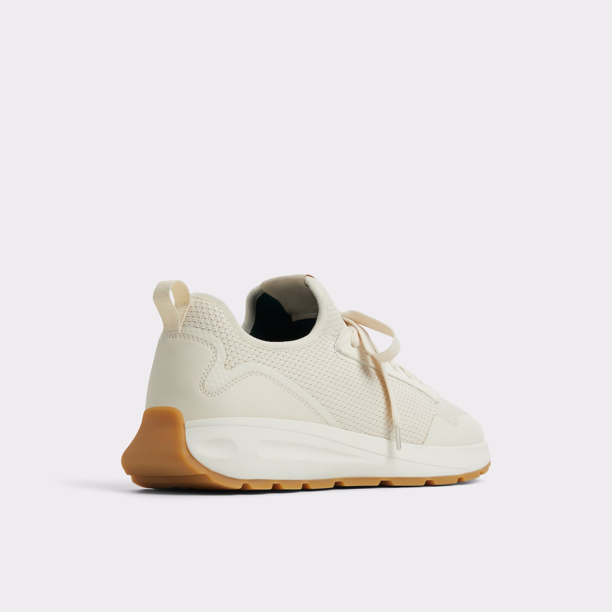 Three-quarter angle of Light Beige Garrick Jogger sneaker's back side