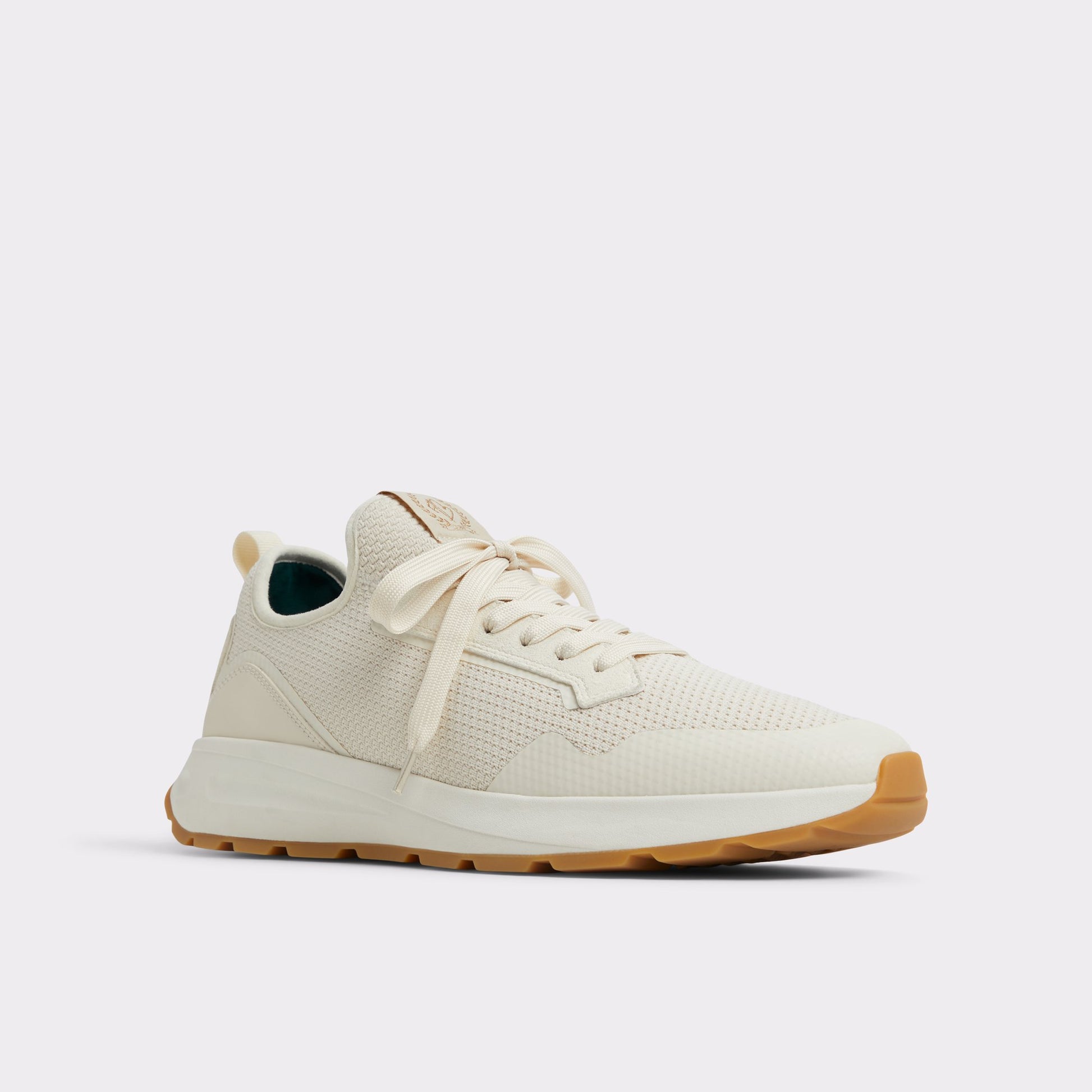 Three-quarter angle of Light Beige Garrick Jogger sneaker's front side