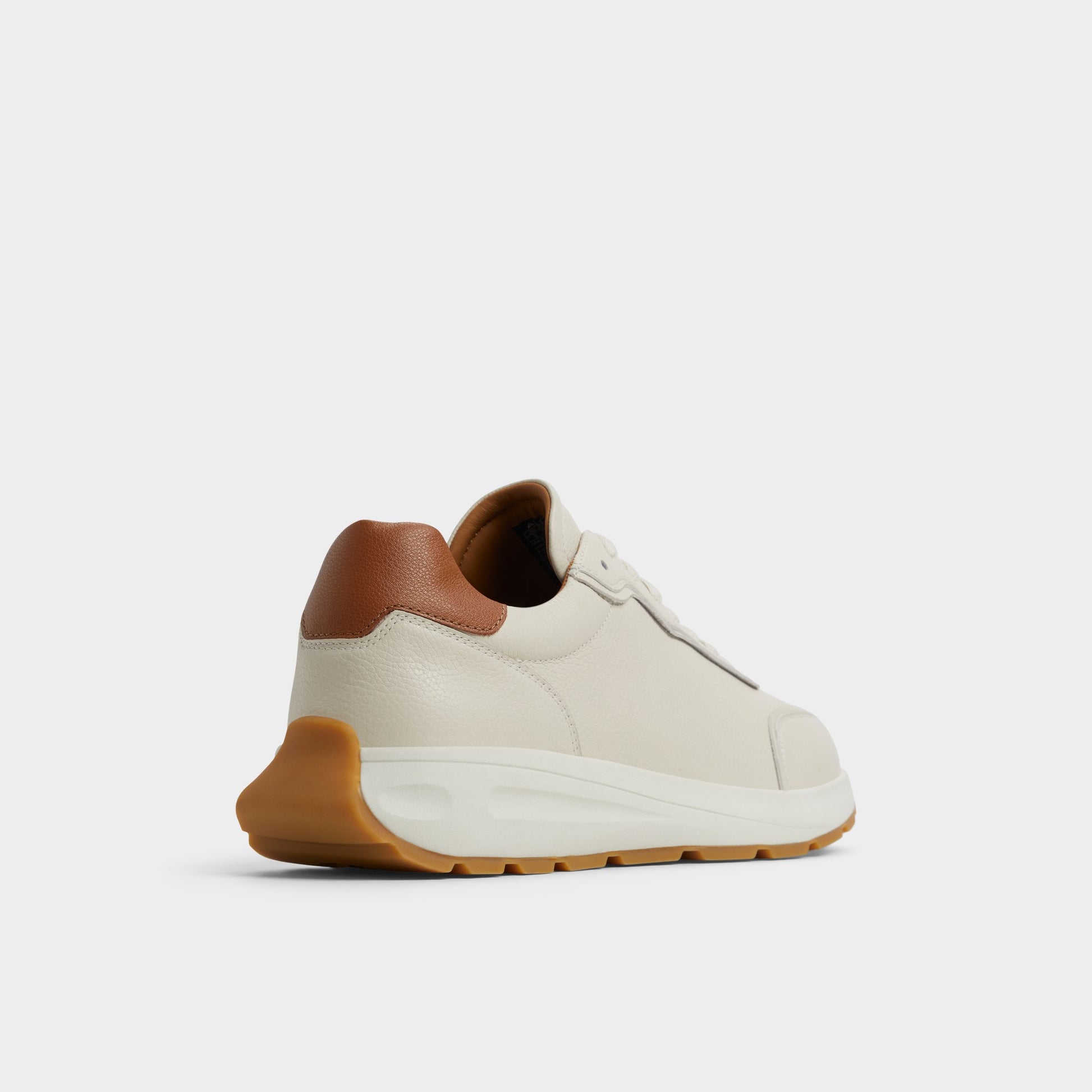 Three-quarter angle of Ivory Alessio Jogger sneaker's back side