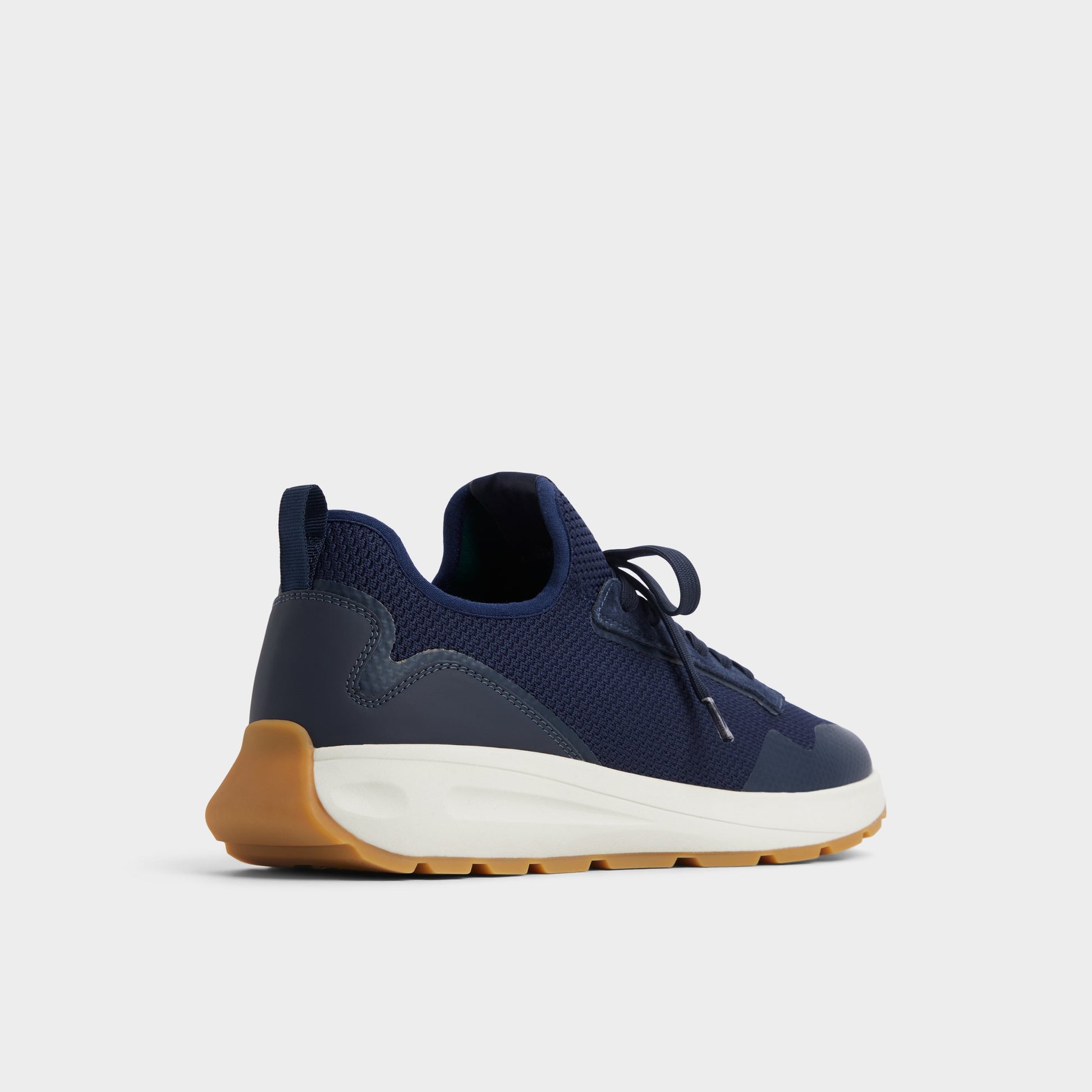 Three-quarter angle of Navy Garrick Jogger sneaker's back side