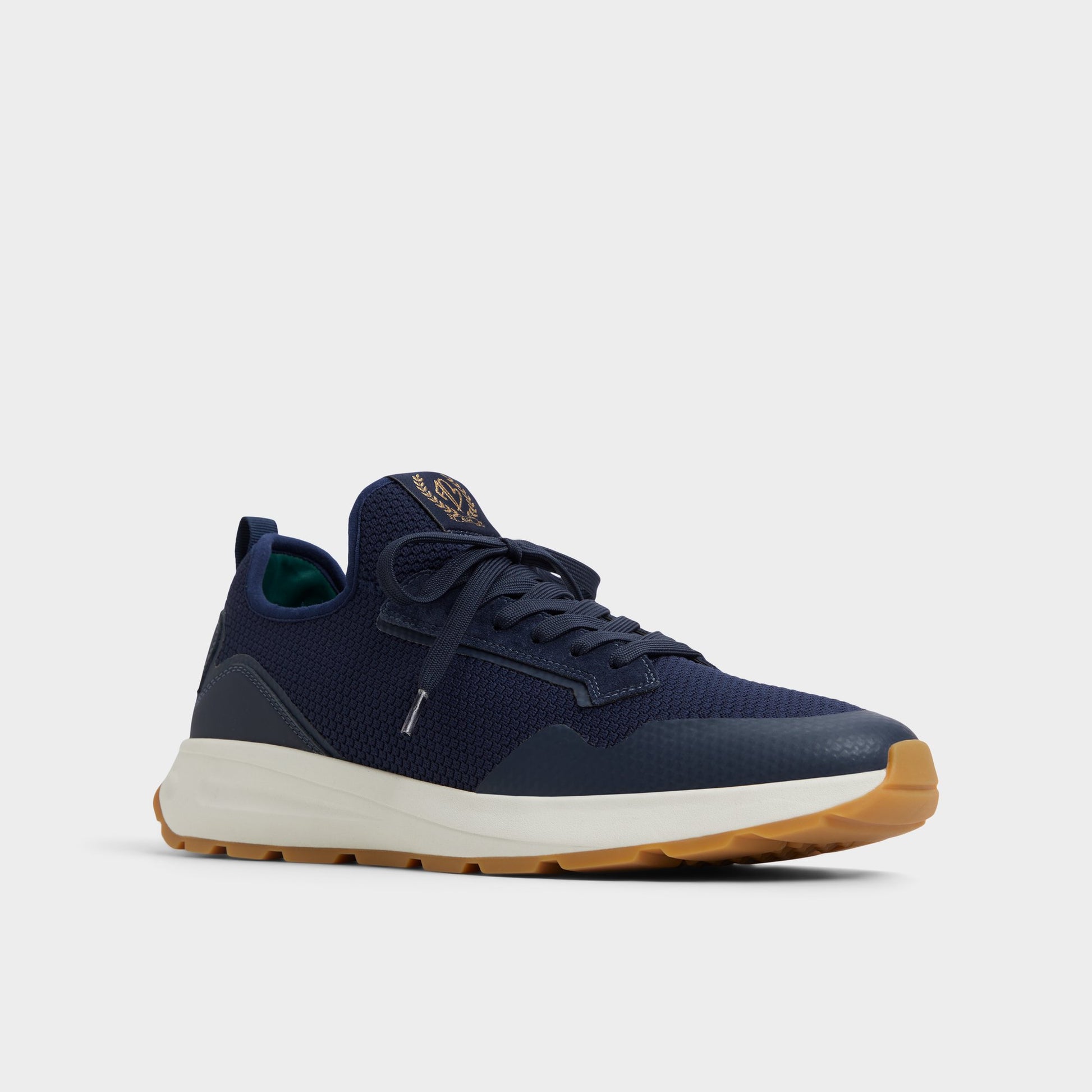 Three-quarter angle of Navy Garrick Jogger sneaker's front side