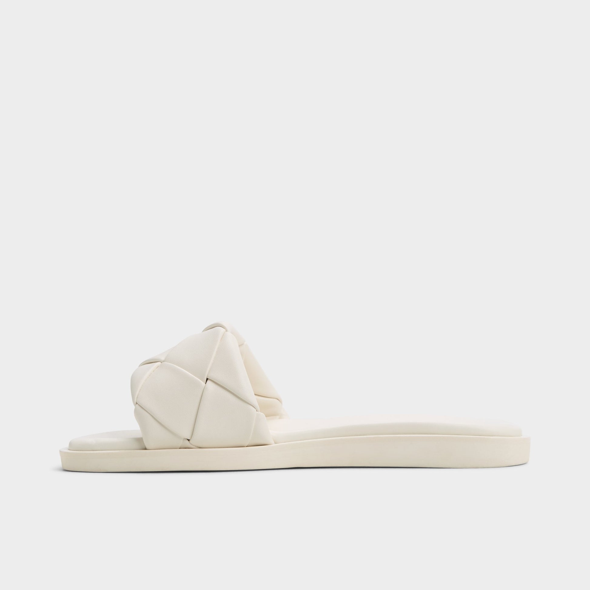 Side view of White Esterelle Slide sandal