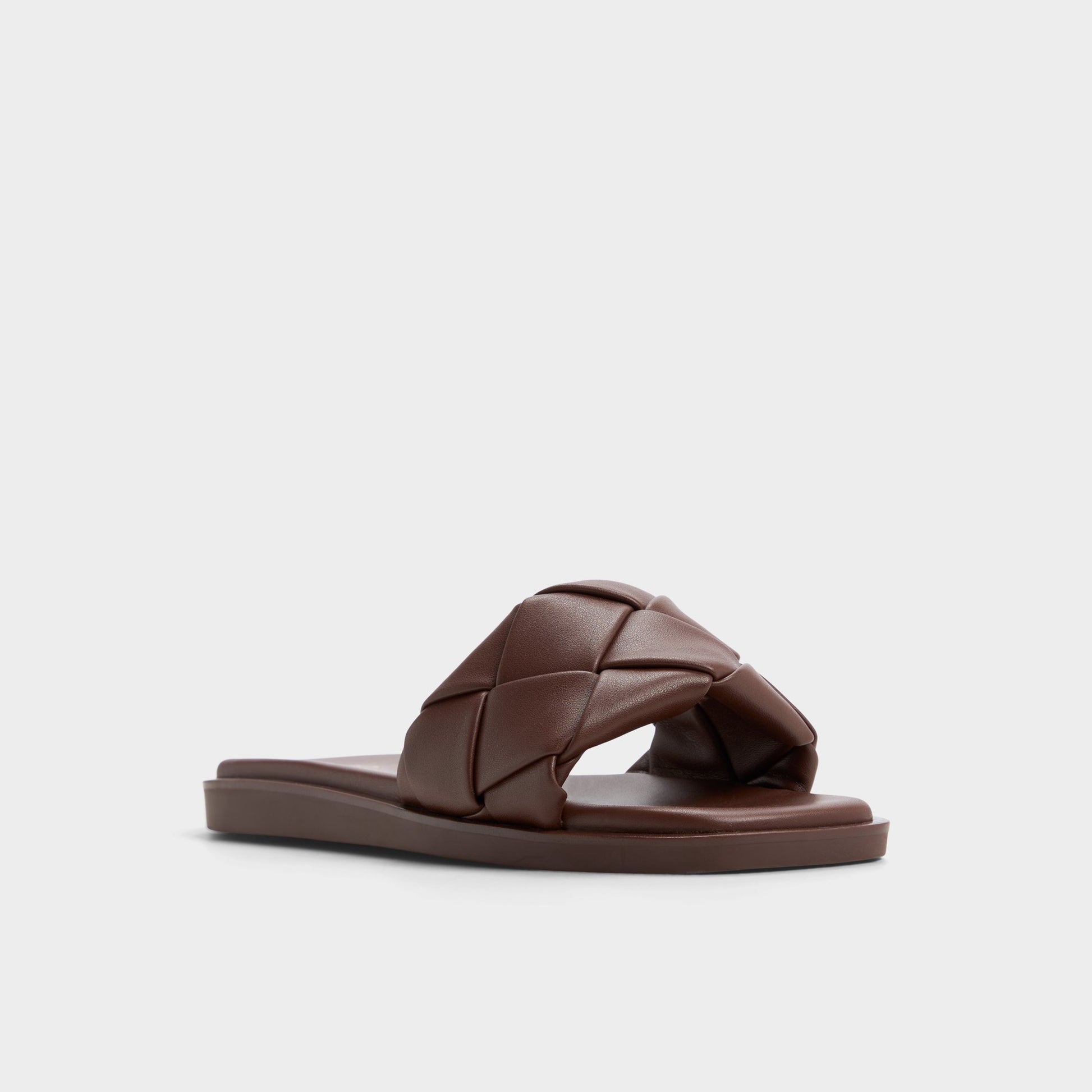 Three-quarter angle of Dark Brown Esterelle Slide sandal's front side