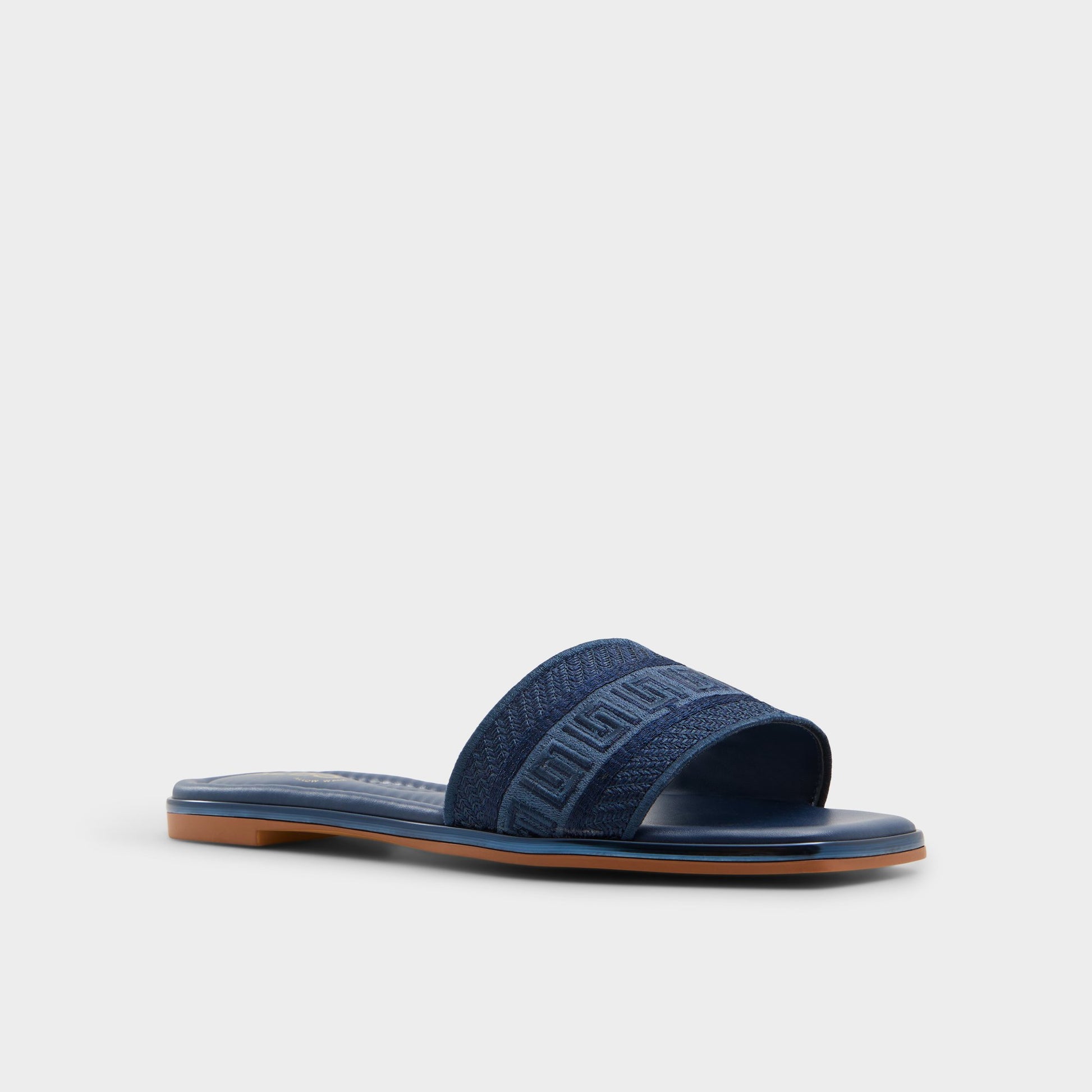 Three-quarter angle of Navy Oceania Slide sandal's front side