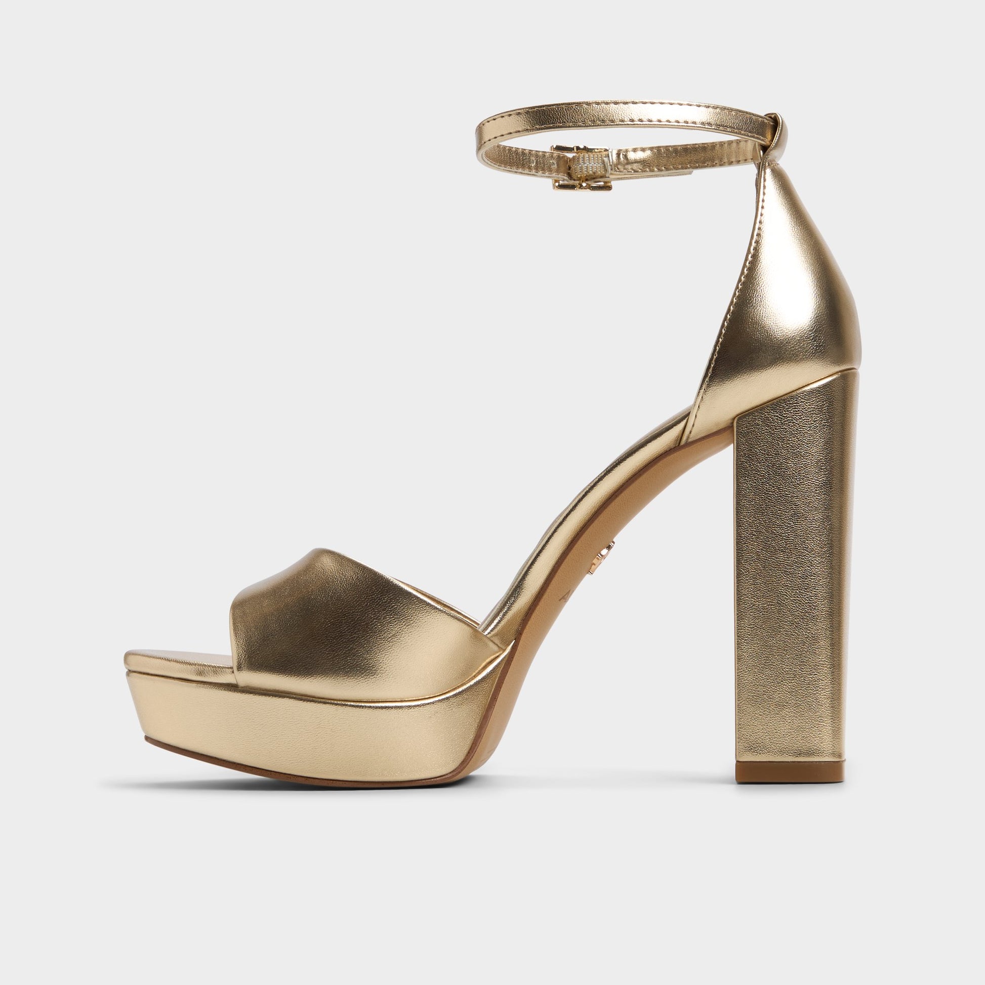 Side view of Gold Enaegyn2.0 Strappy heeled sandal