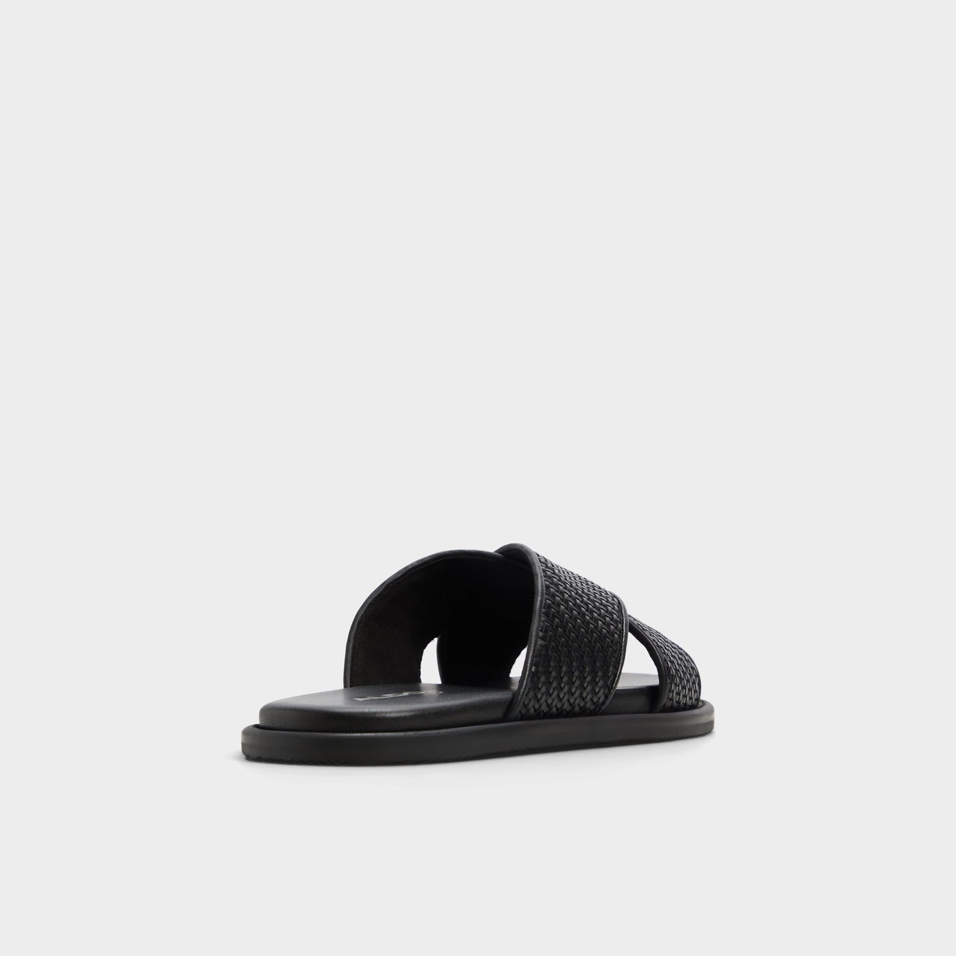 Three-quarter angle of Black Tarik Slide sandal's back side