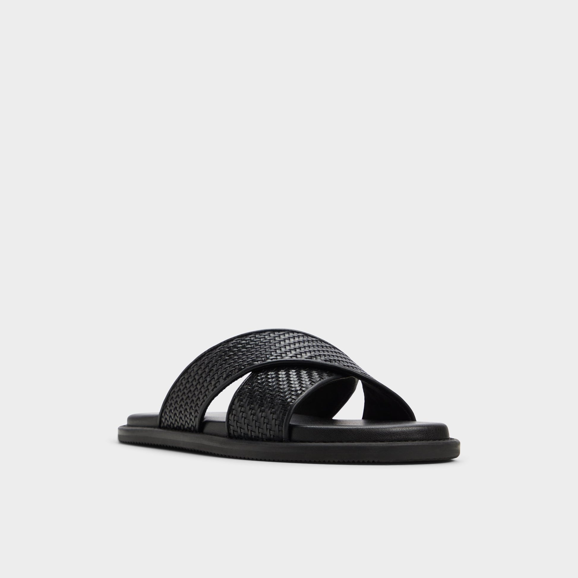 Three-quarter angle of Black Tarik Slide sandal's front side