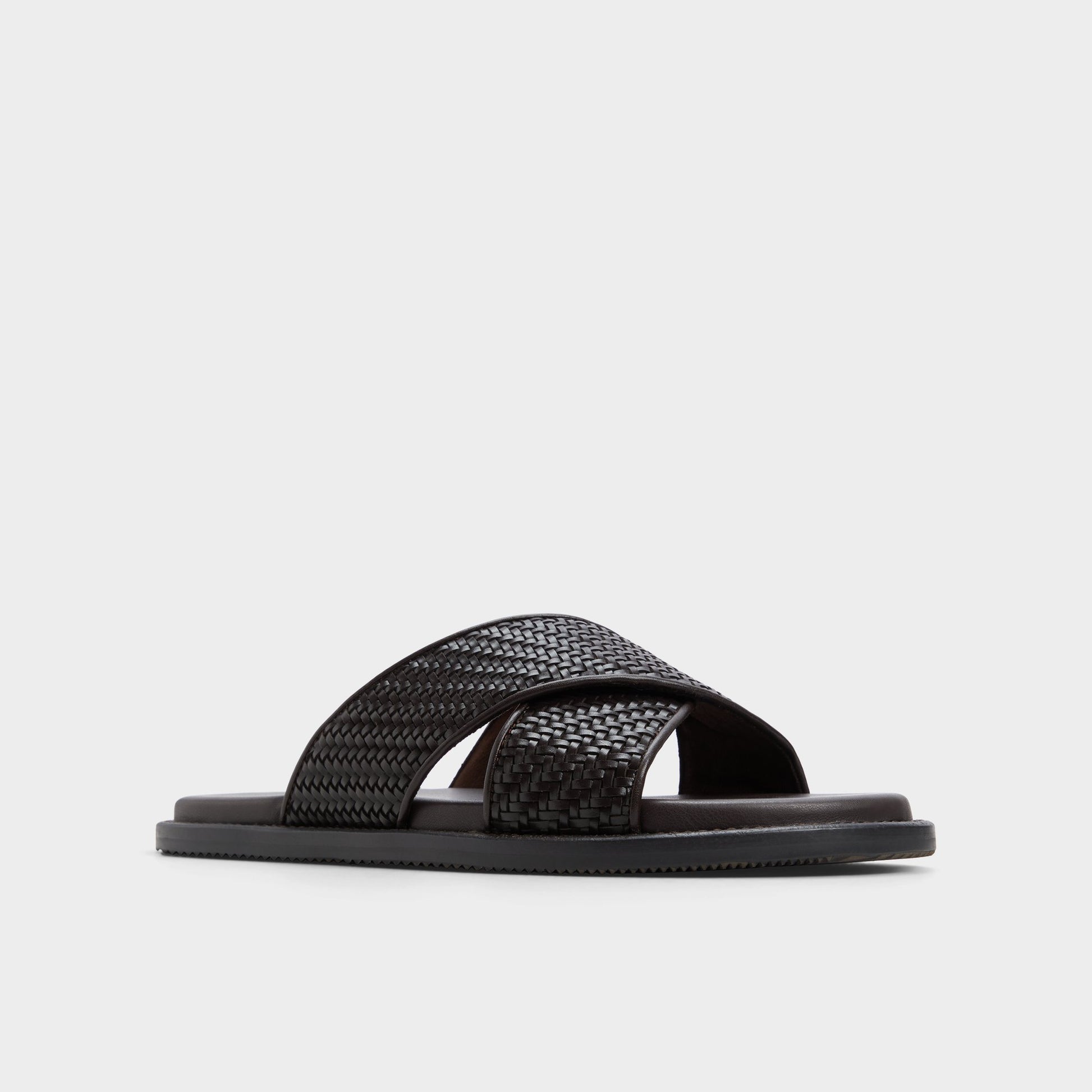 Three-quarter angle of Dark Brown Tarik Slide sandal's front side