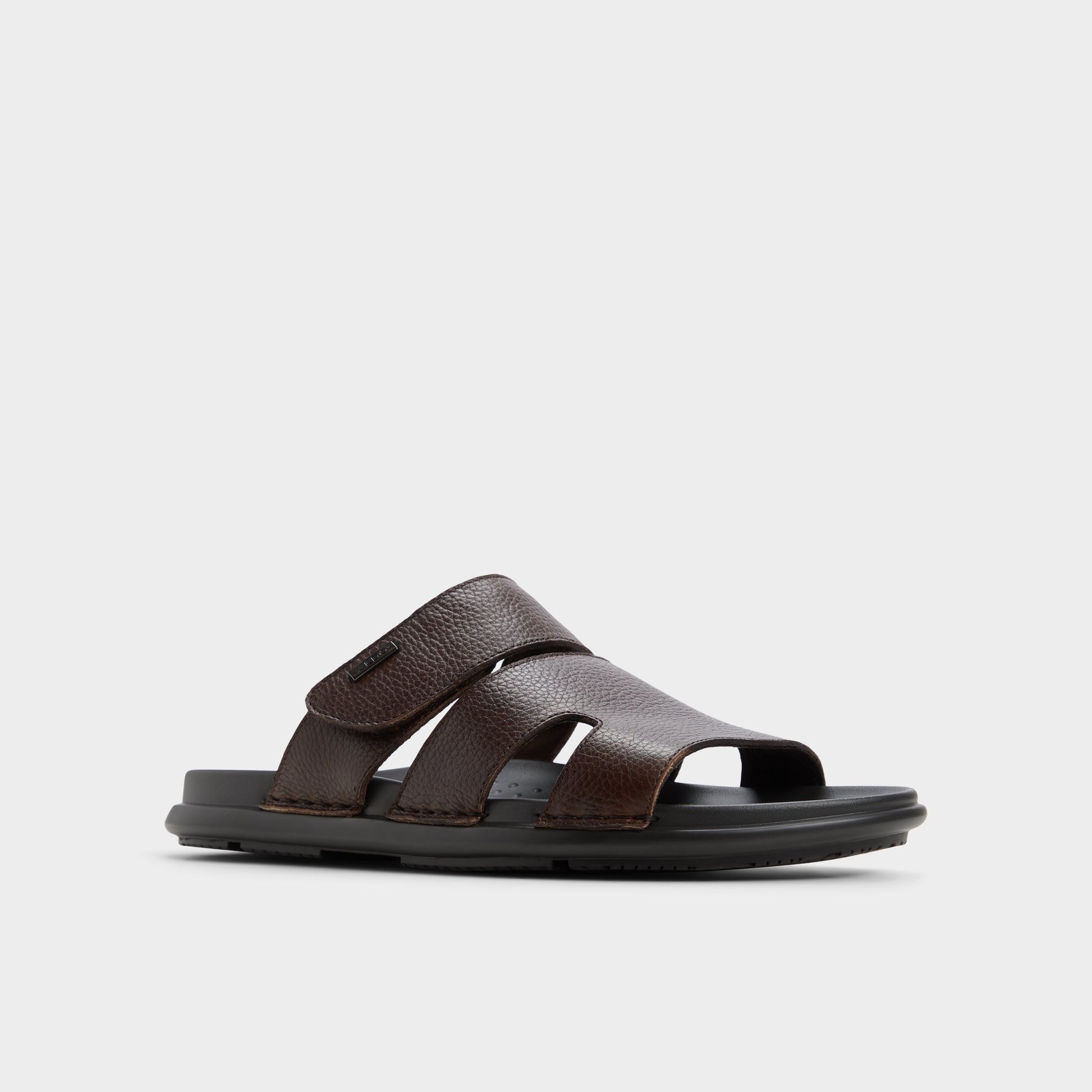 Three-quarter angle of Dark Brown Windham Slide sandal's front side