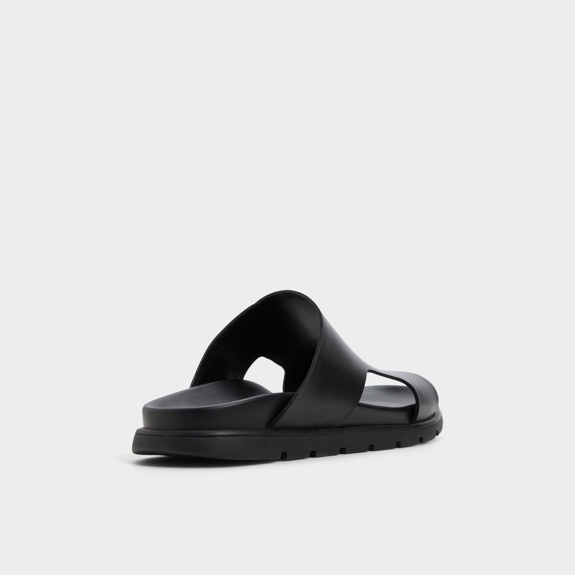 Three-quarter angle of Black Soar Slide sandal's back side