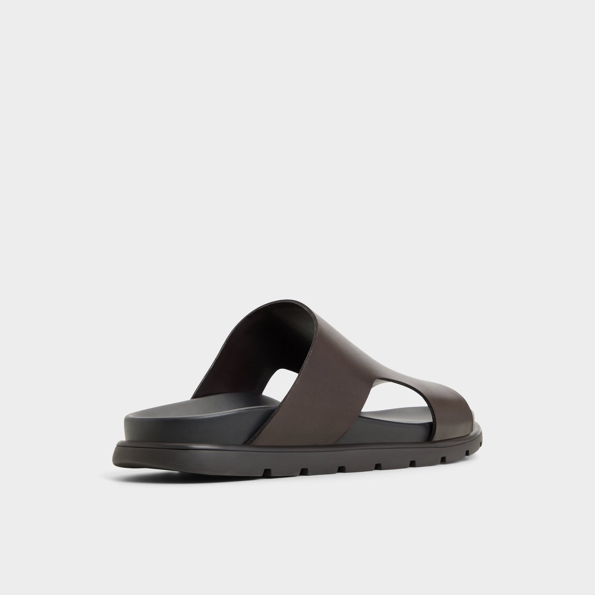 Three-quarter angle of Dark Brown Soar Slide sandal's back side