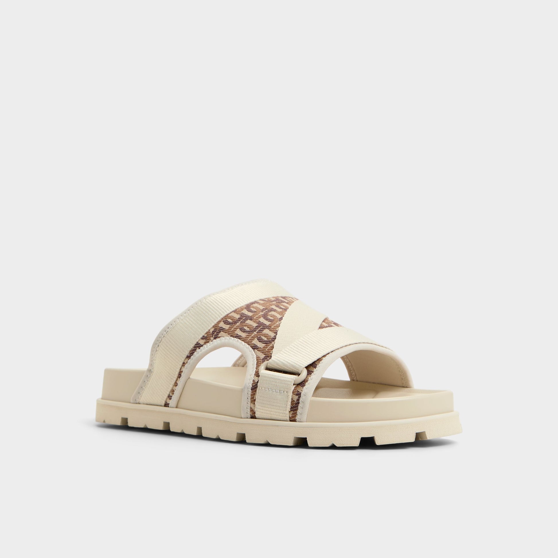Three-quarter angle of Medium Beige Deniels Slide sandal's front side