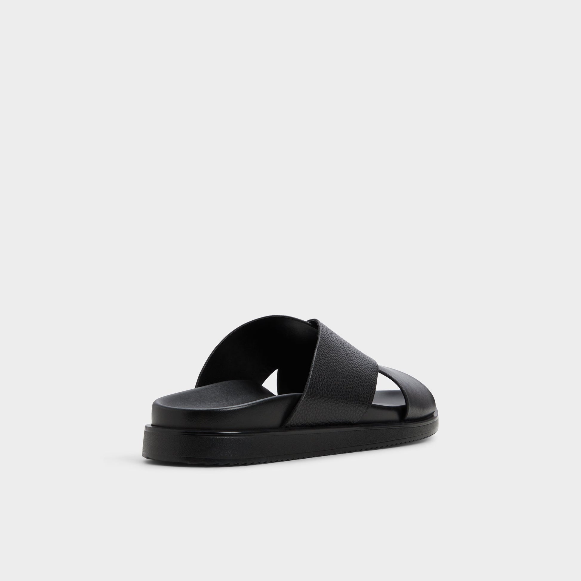 Three-quarter angle of Black Darley Strappy flat sandal's back side