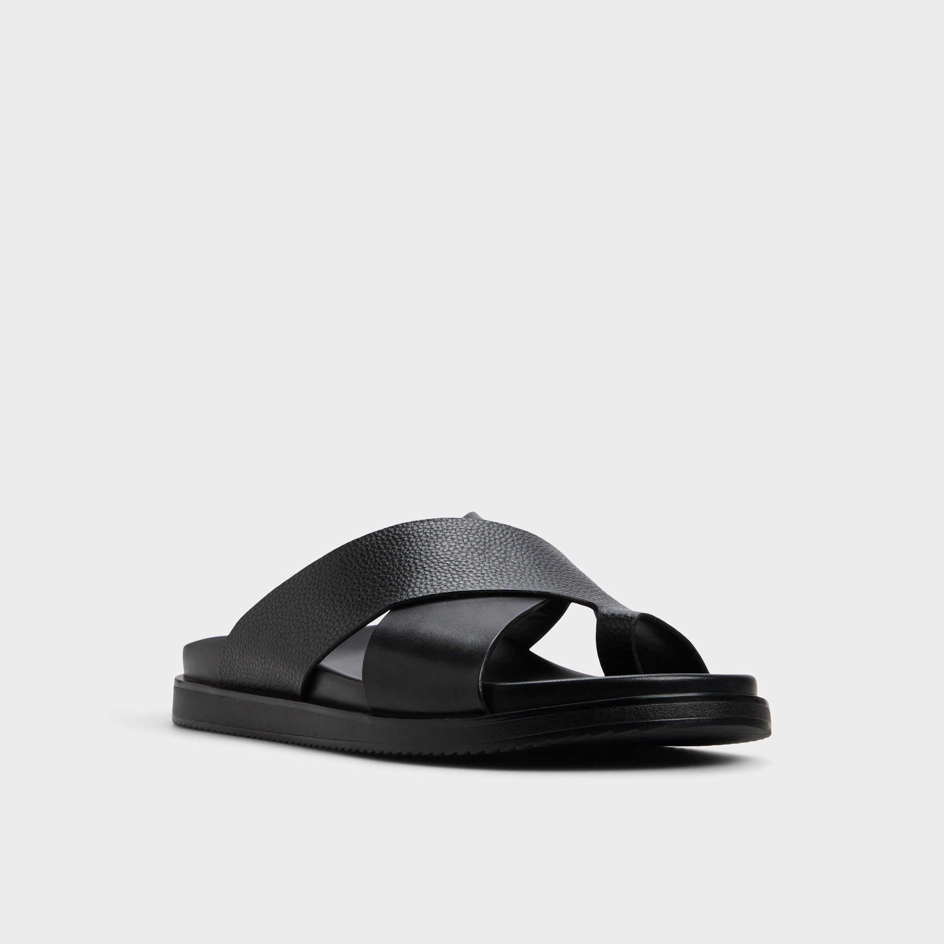 Three-quarter angle of Black Darley Strappy flat sandal's front side