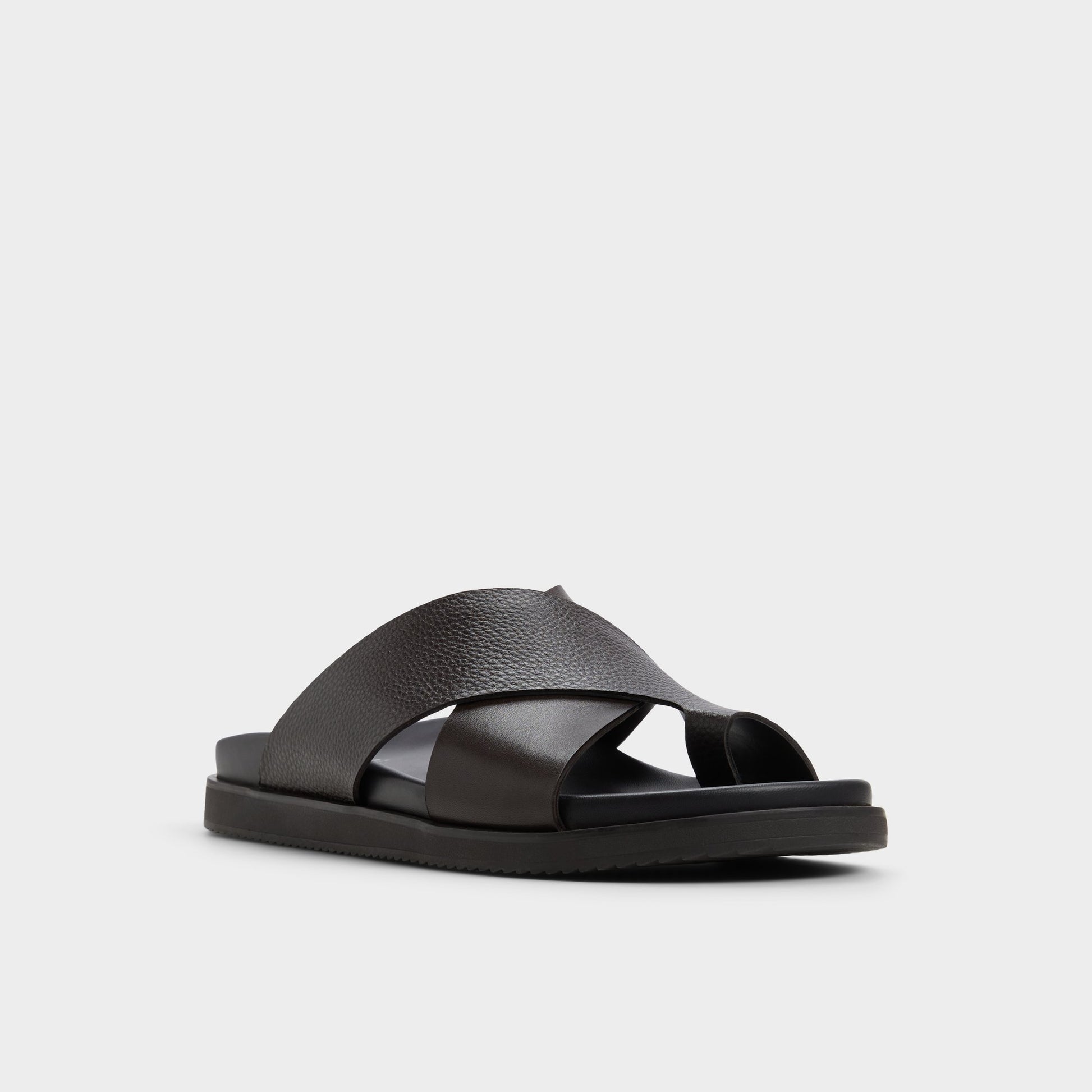 Three-quarter angle of Dark Brown Darley Strappy flat sandal's front side