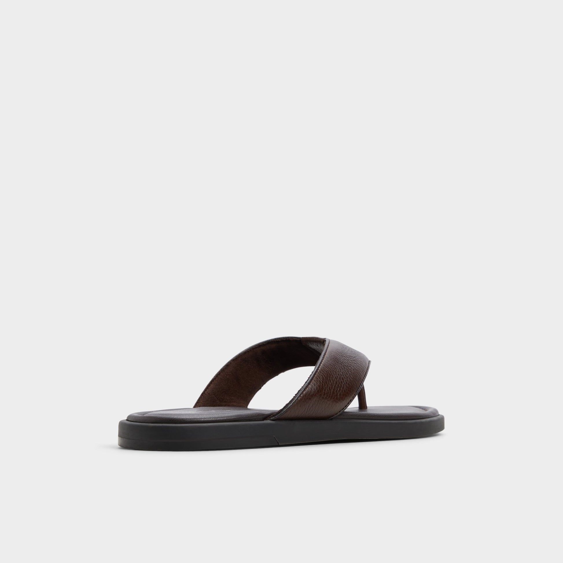 Three-quarter angle of Dark Brown Tazzo Flip flop's back side