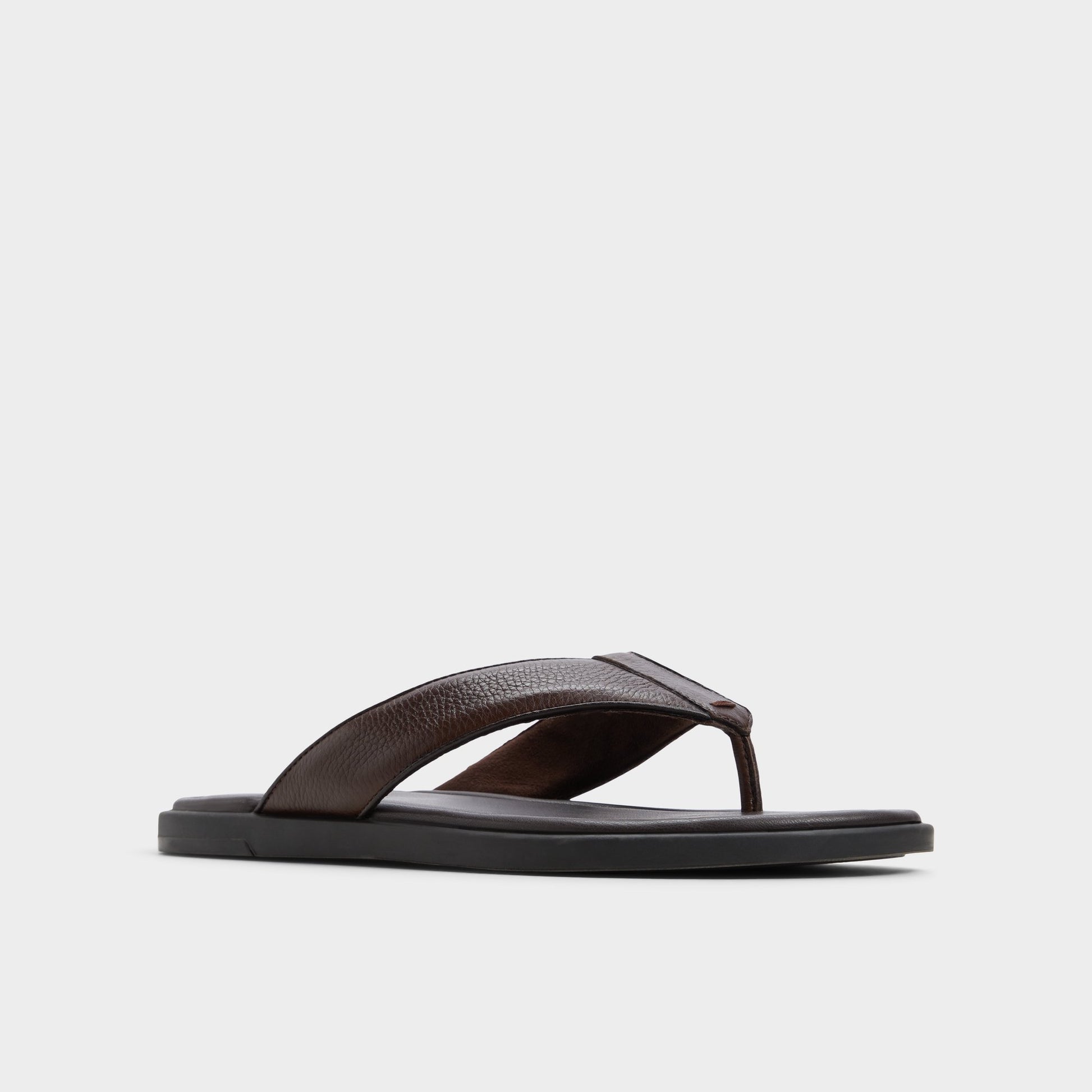Three-quarter angle of Dark Brown Tazzo Flip flop's front side