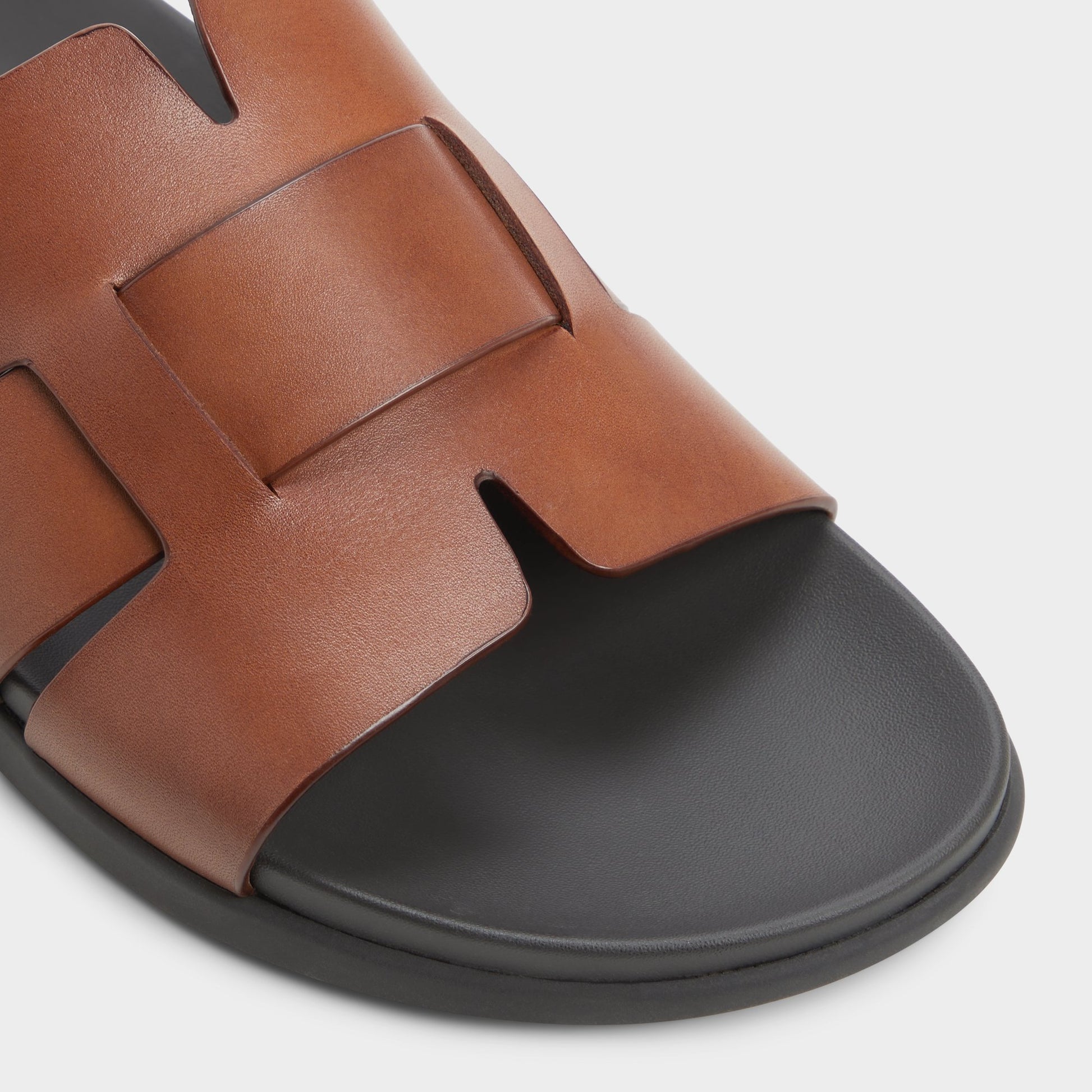 Close-up of the Cognac Padien Slide sandal