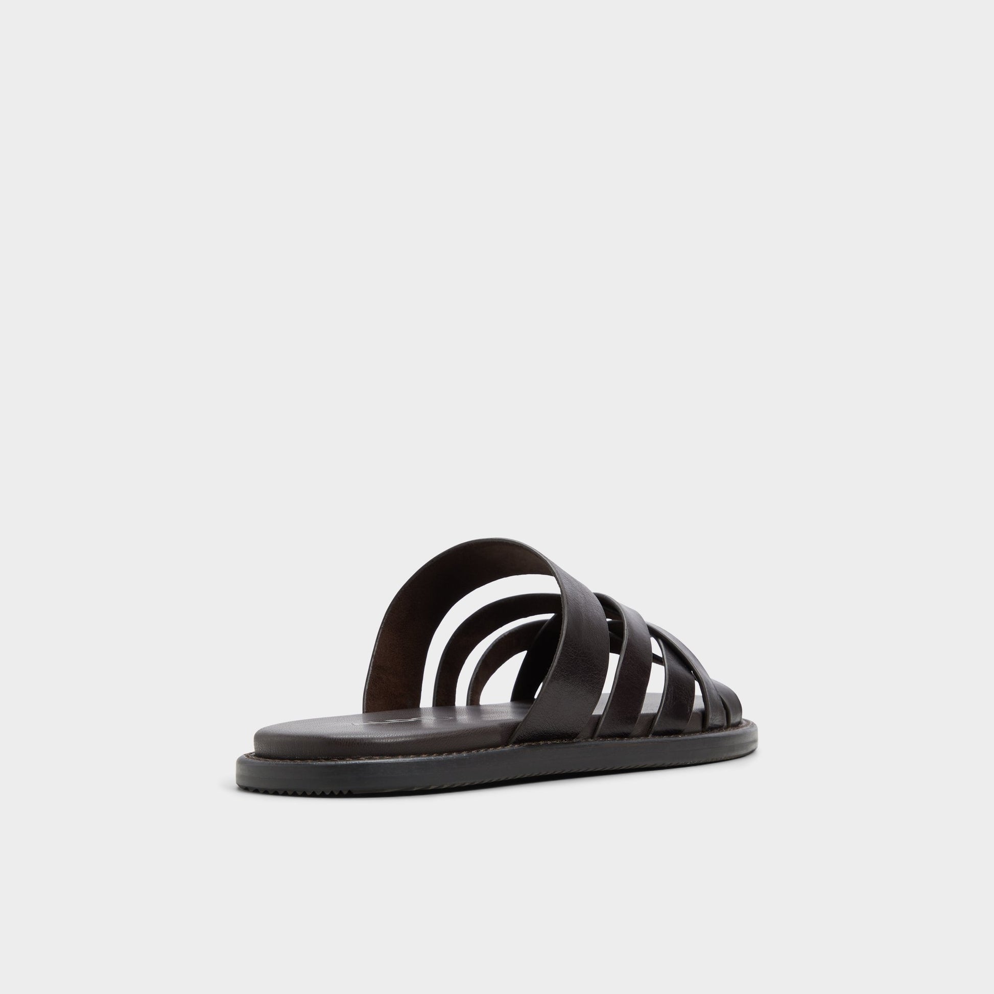 Three-quarter angle of Brown Haniff Strappy flat sandal's back side