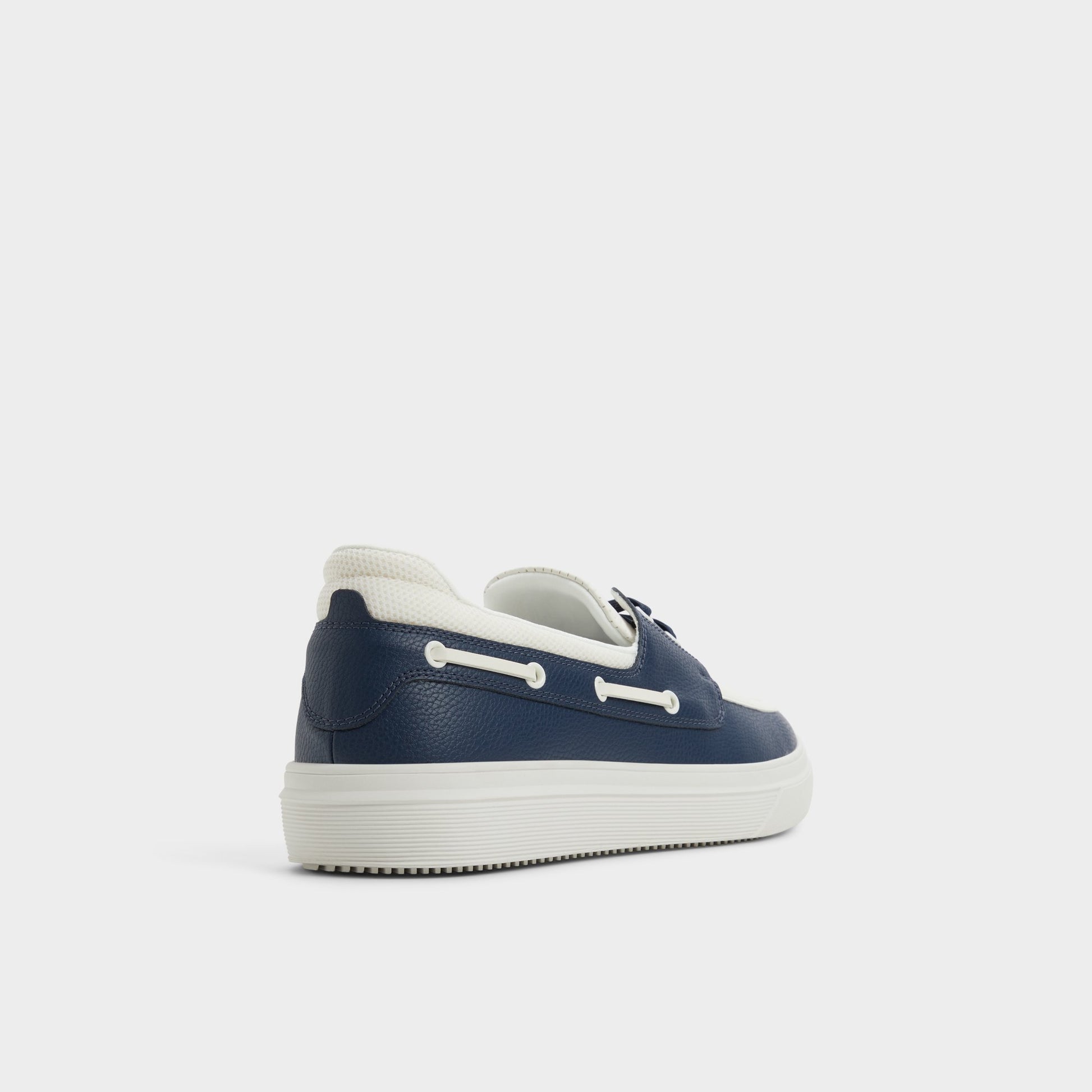 Three-quarter angle of White/Navy Wildwave Boat shoe's back side