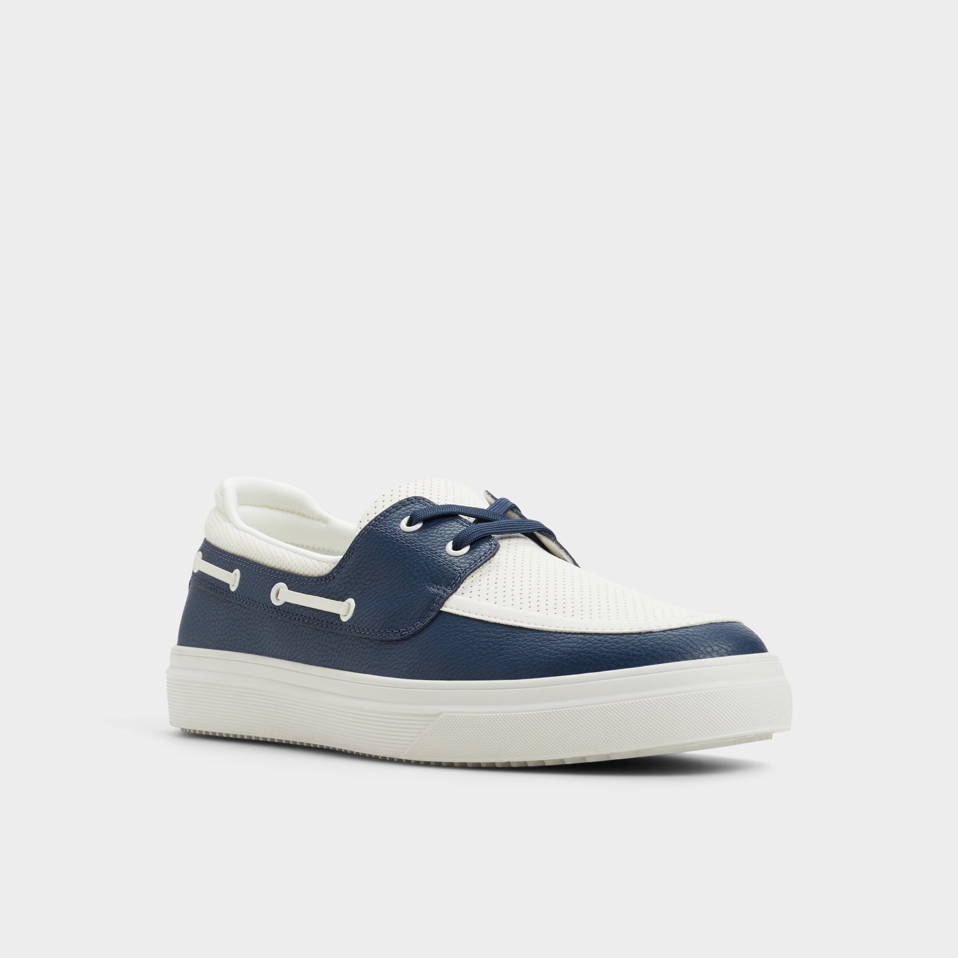 Three-quarter angle of White/Navy Wildwave Boat shoe's front side