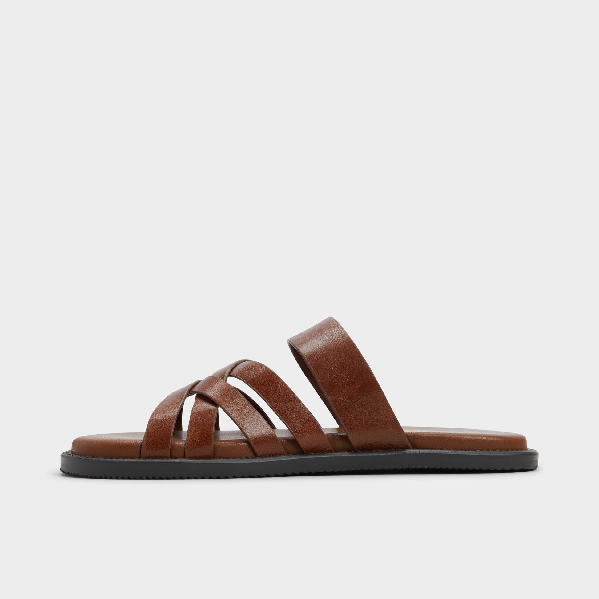 Side view of Cognac Haniff Strappy flat sandal