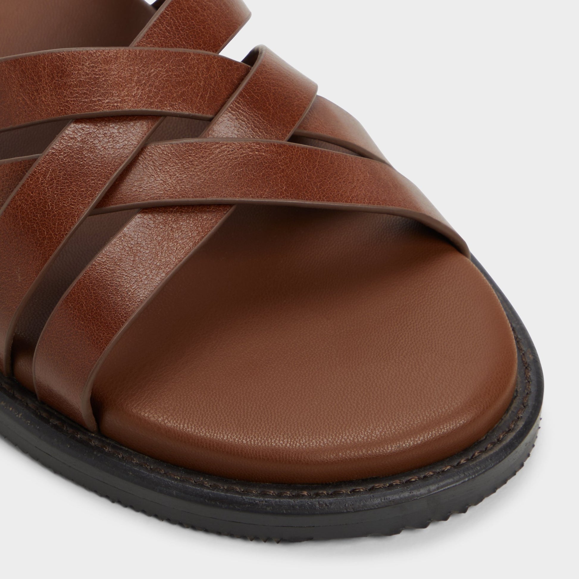 Close-up of the Cognac Haniff Strappy flat sandal