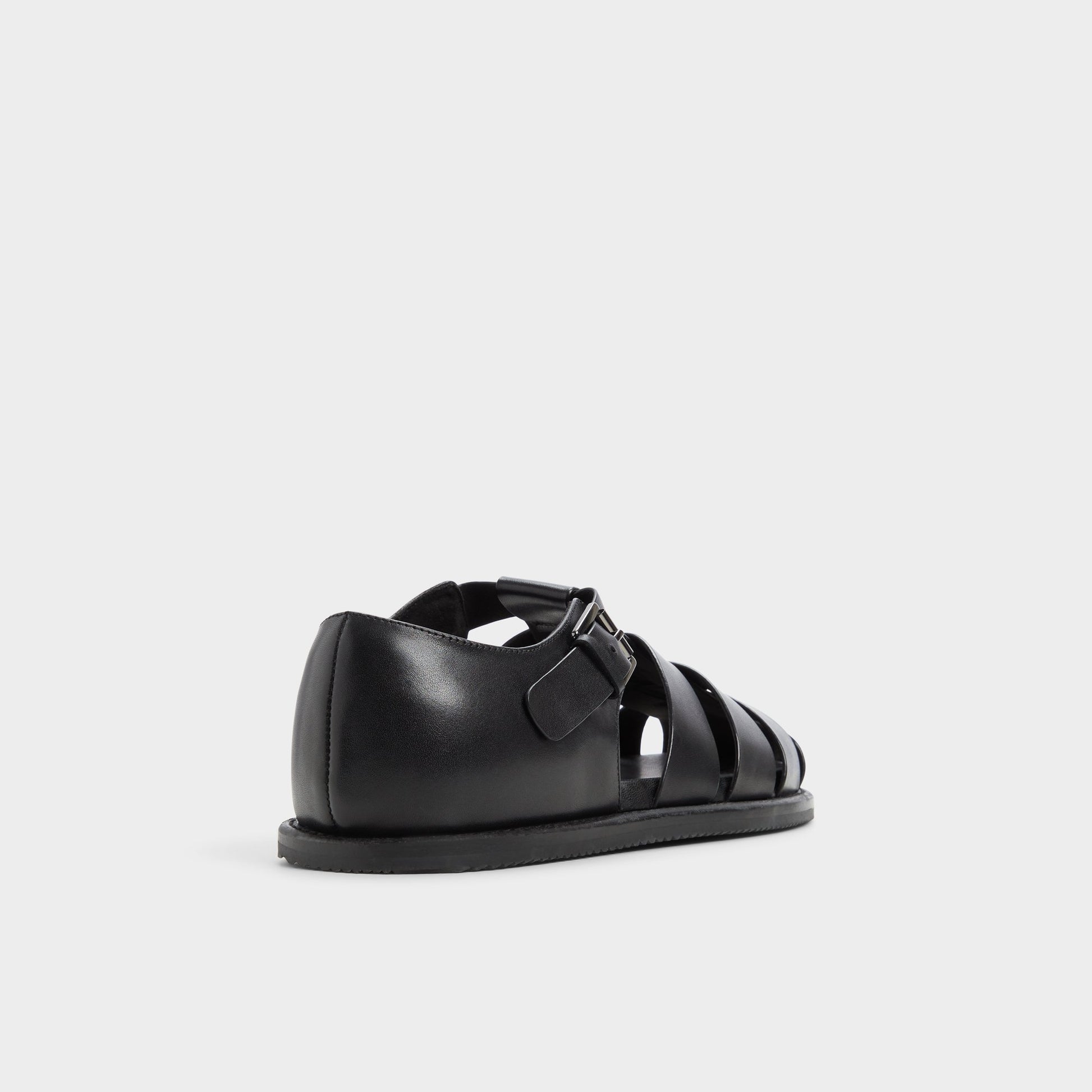 Three-quarter angle of Black Wildhaven Flat sandal's back side