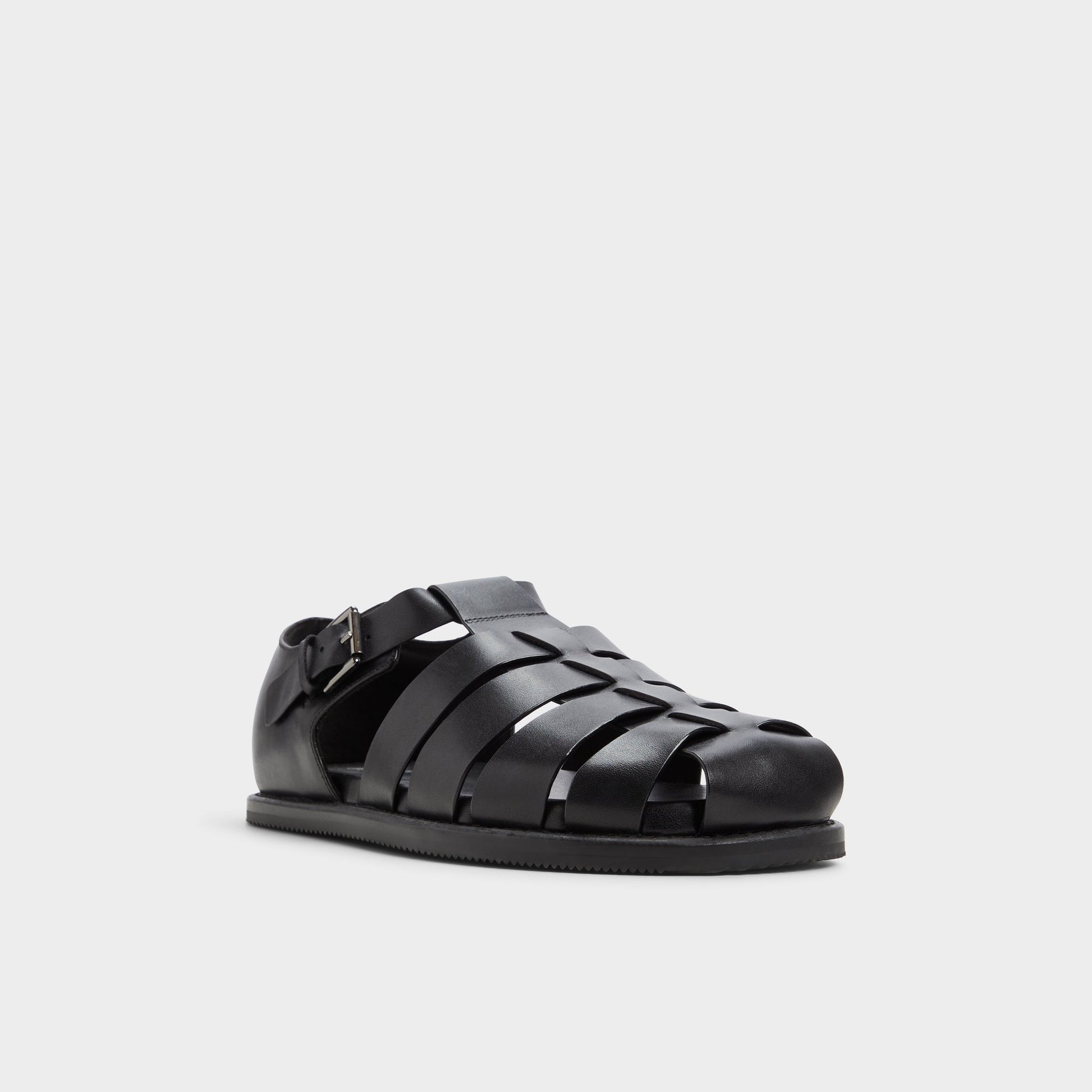 Three-quarter angle of Black Wildhaven Flat sandal's front side