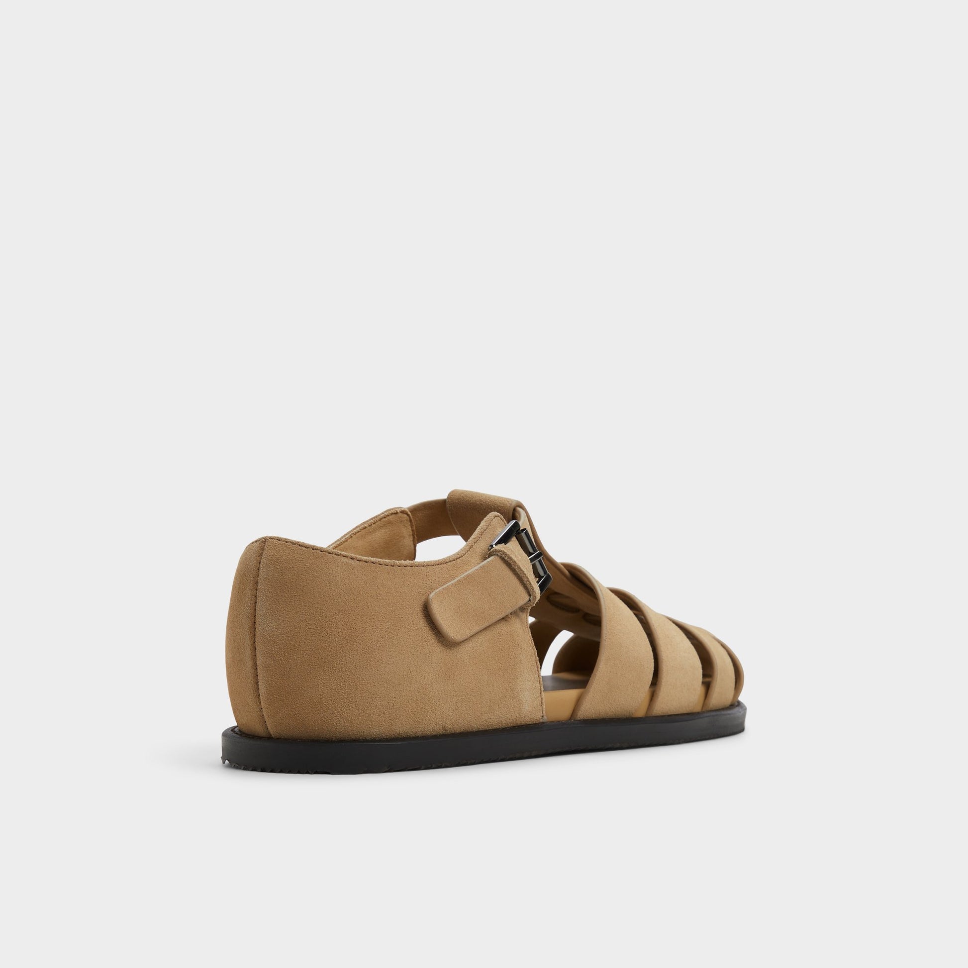 Three-quarter angle of Taupe Wildhaven Flat sandal's back side