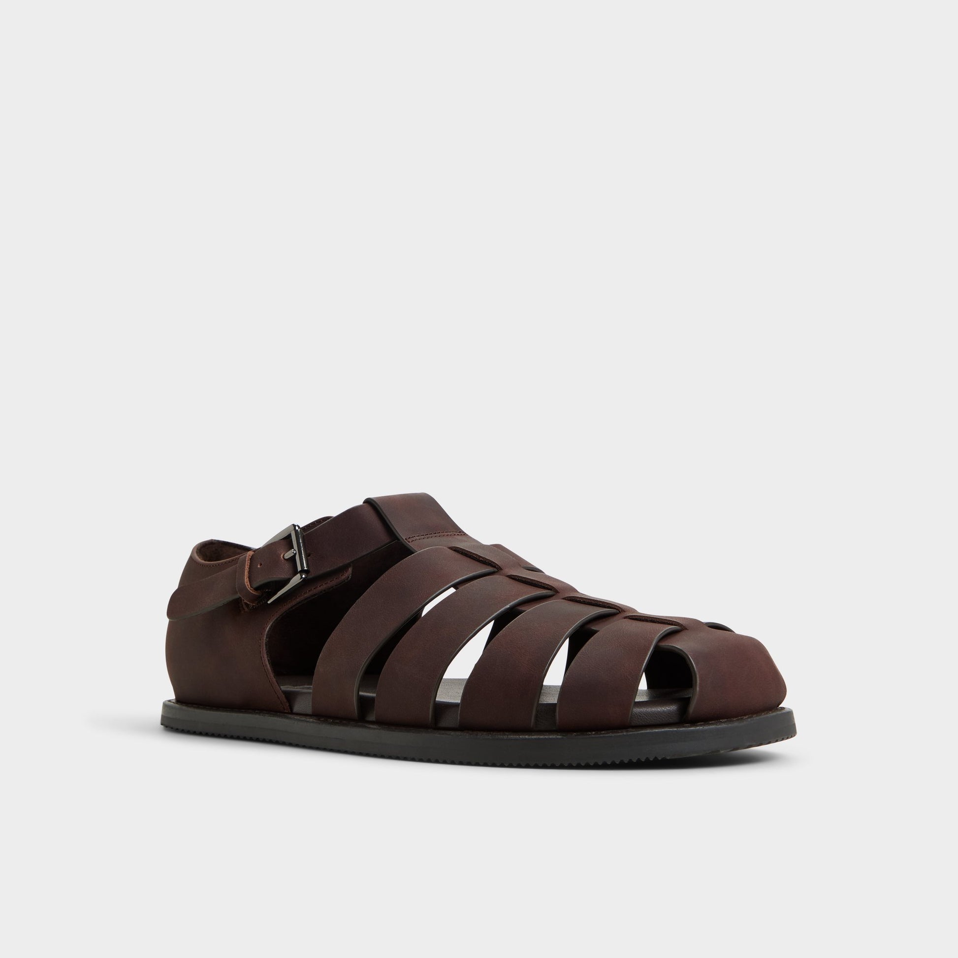 Three-quarter angle of Brown Overflow Wildhaven Flat sandal's front side
