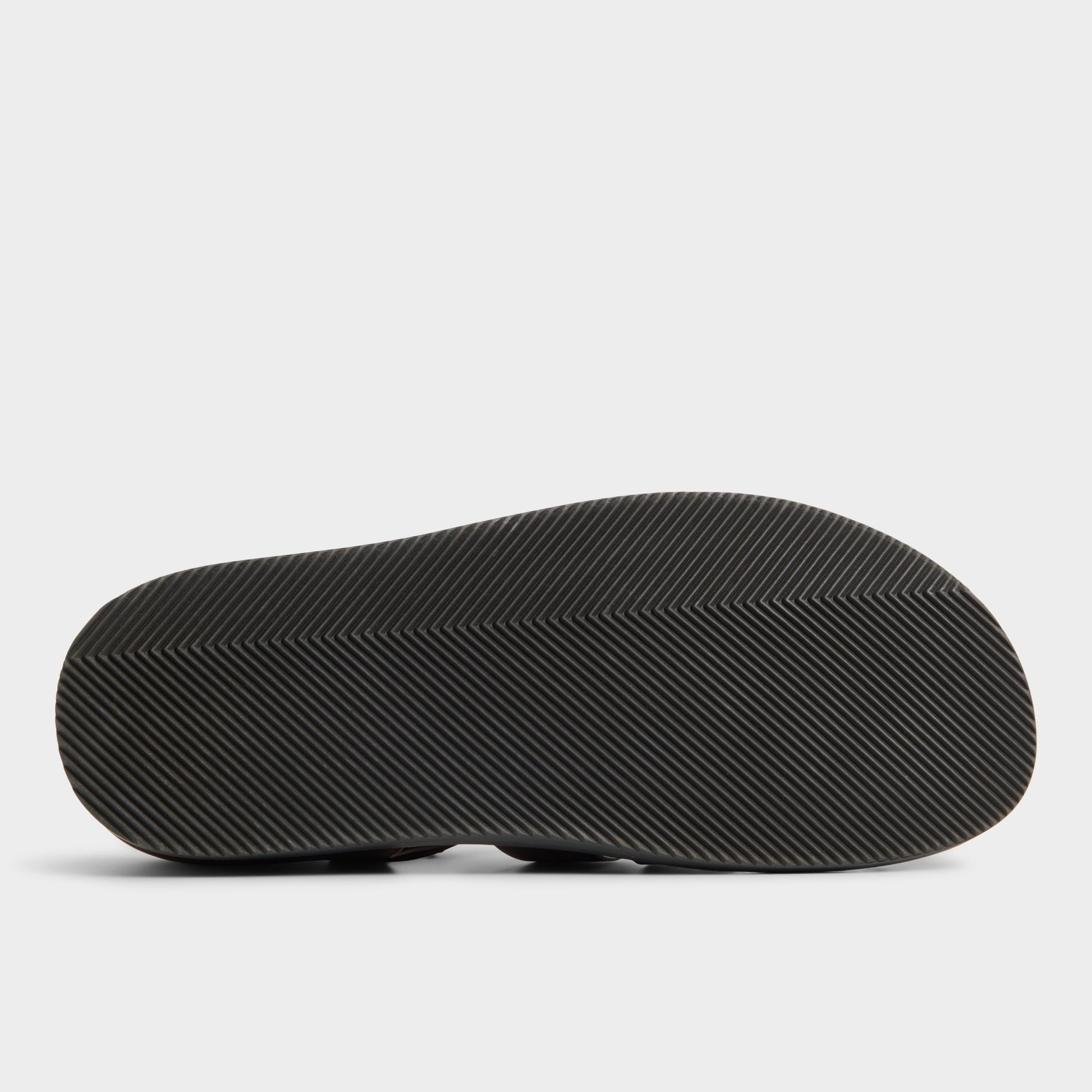 View of Brown Overflow Wildhaven Flat sandal's sole