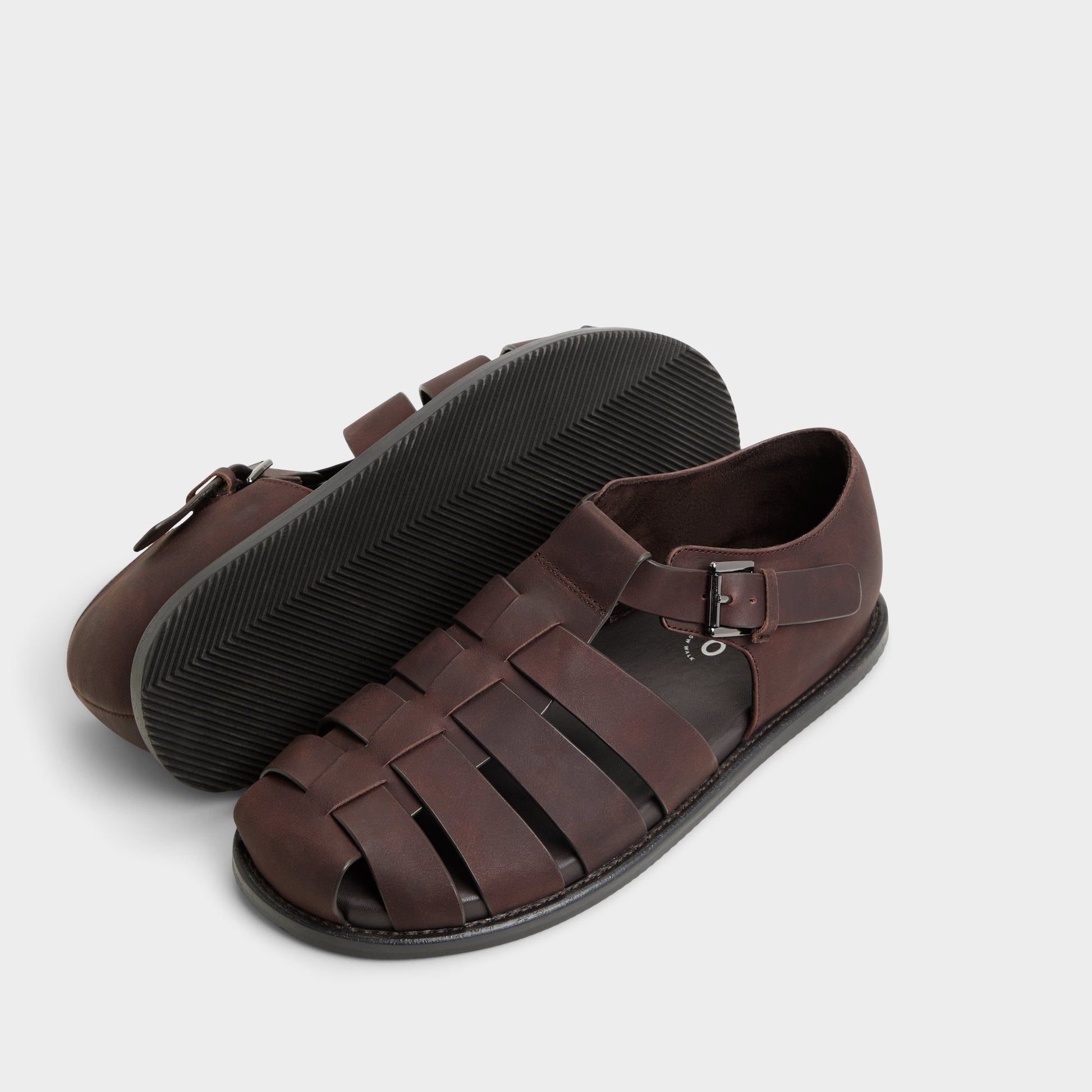 Highlighted view of a pair of Brown Overflow Wildhaven Flat sandals