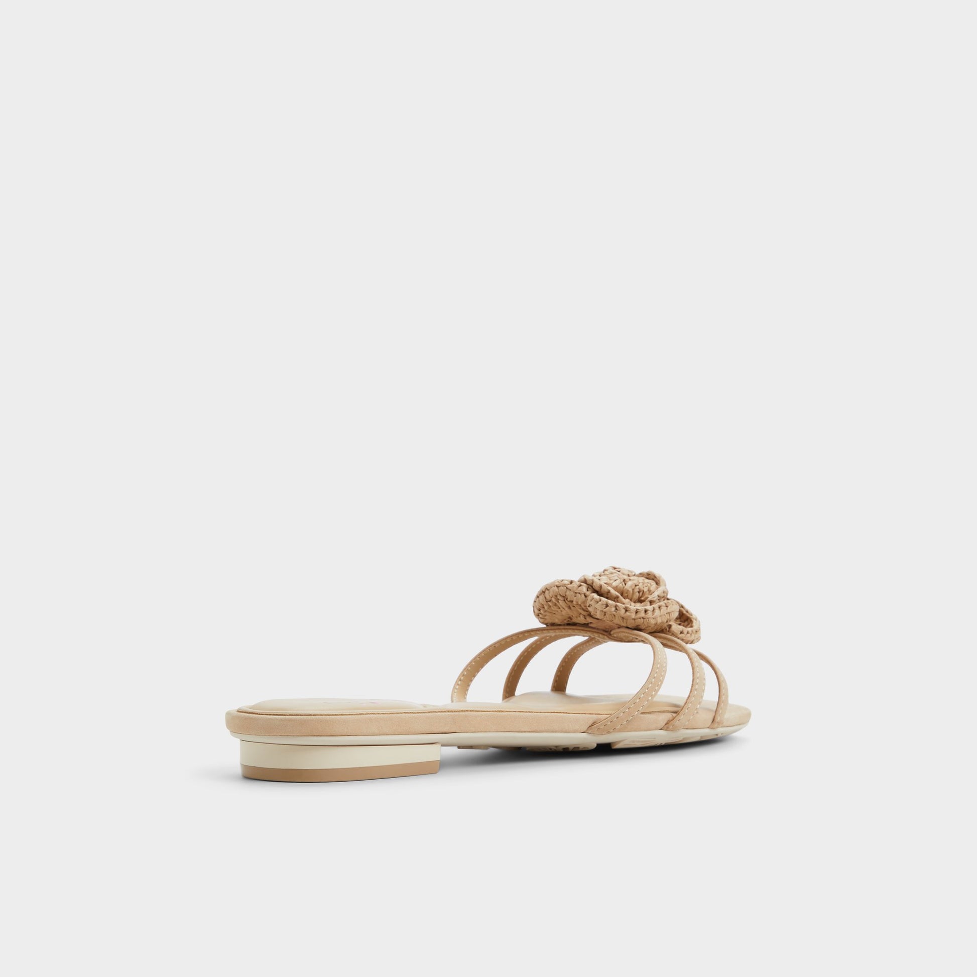 Three-quarter angle of Sand Wildbloom Strappy flat sandal's back side