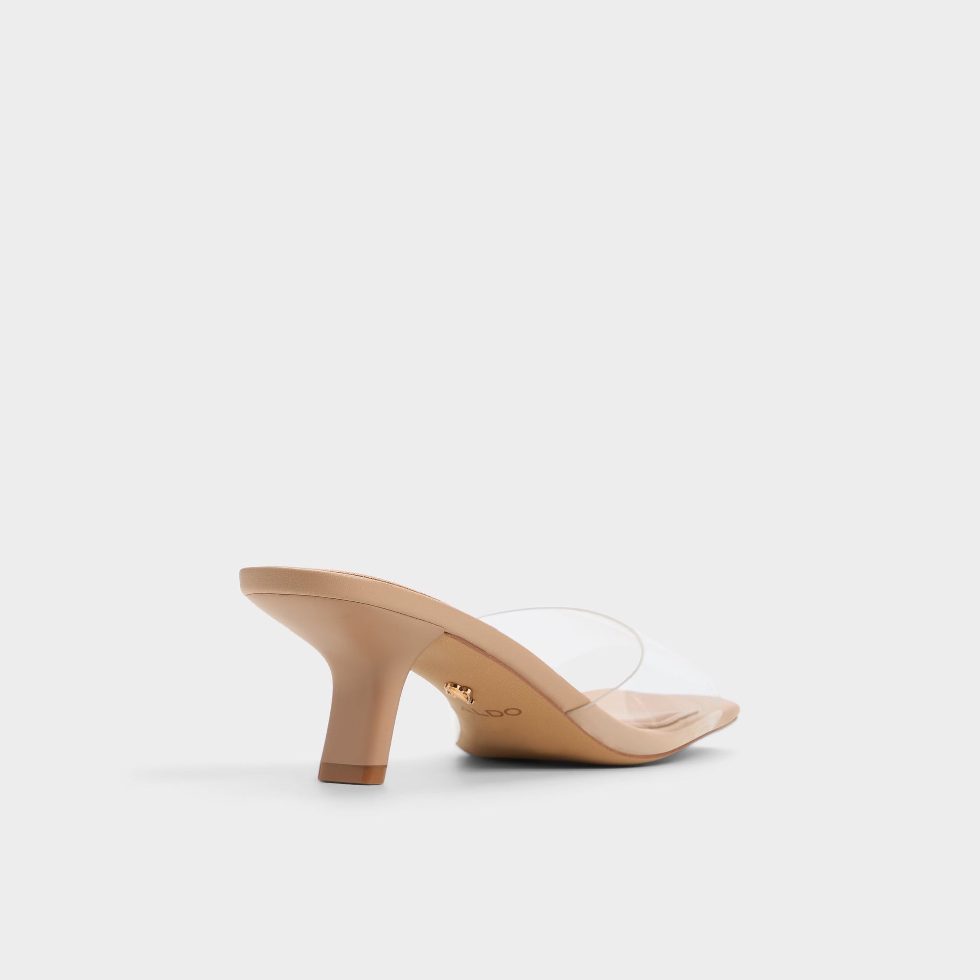 Three-quarter angle of Tan Enchanting Heeled mule's back side