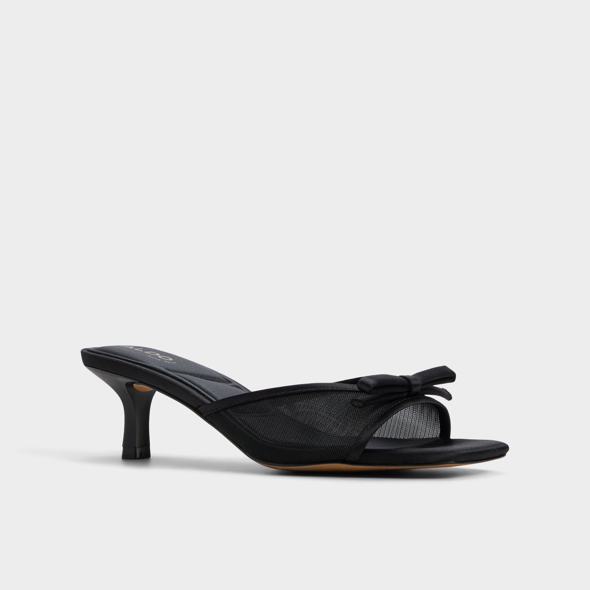 Three-quarter angle of Black Begoniaa Heeled mule's front side