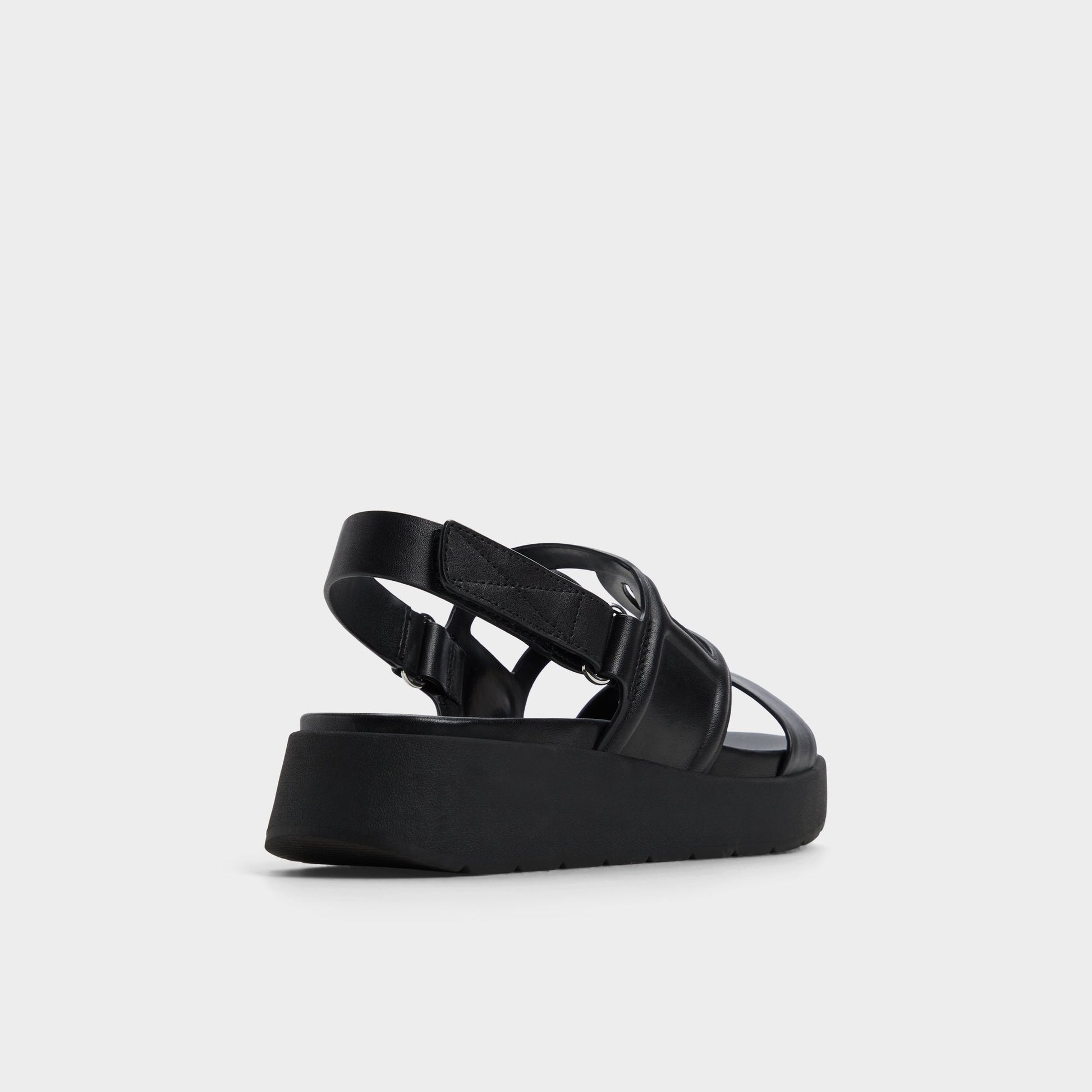 Three-quarter angle of Black Onuvia Footbed sandal's back side