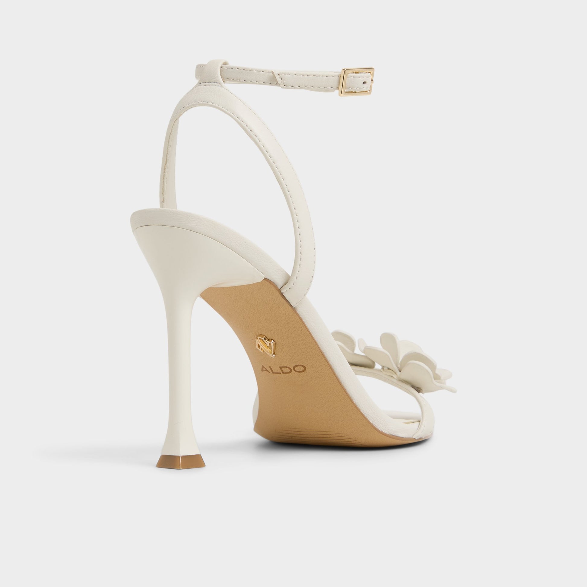 Three-quarter angle of White/Bone Daisylily Strappy heeled sandal's back side