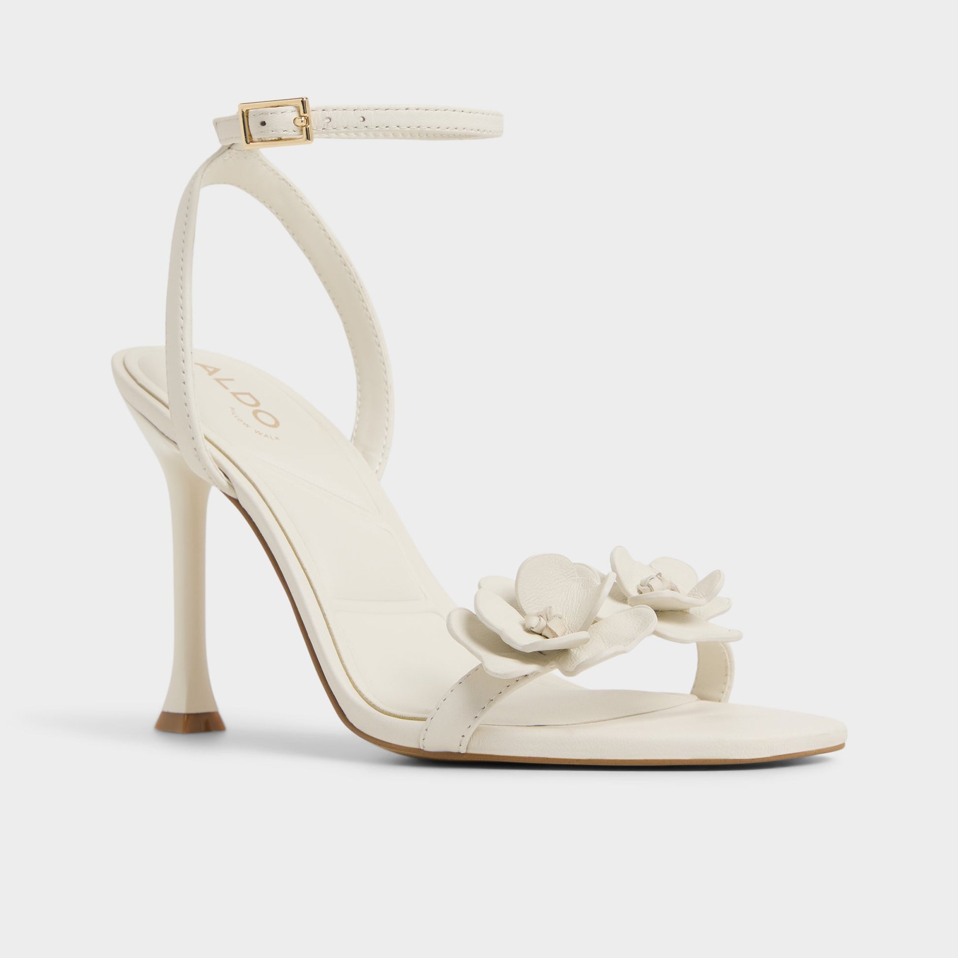 Three-quarter angle of White/Bone Daisylily Strappy heeled sandal's front side