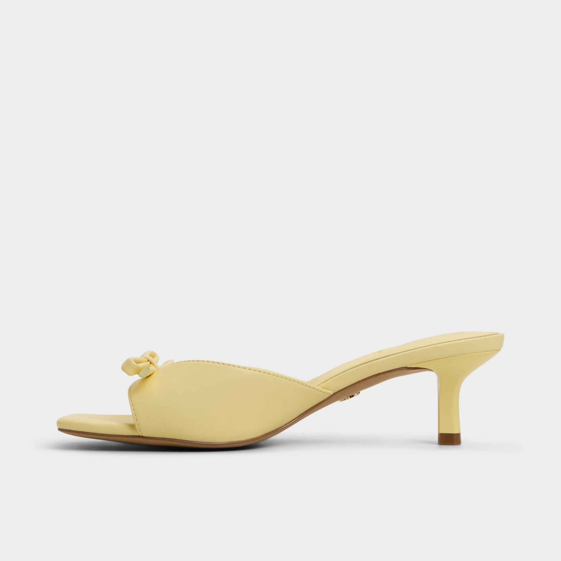 Side view of Light Yellow Belerose Heeled mule