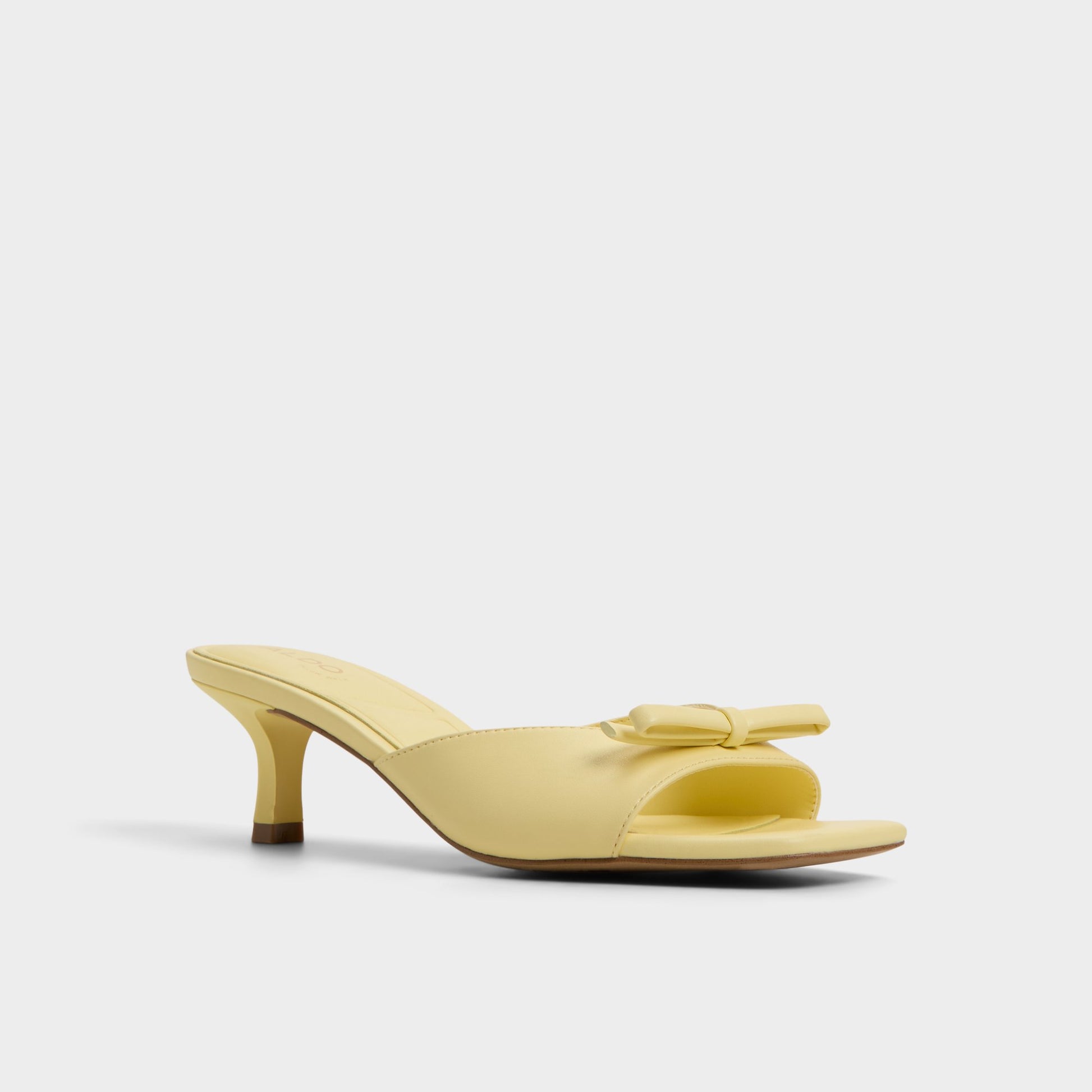Three-quarter angle of Light Yellow Belerose Heeled mule's front side