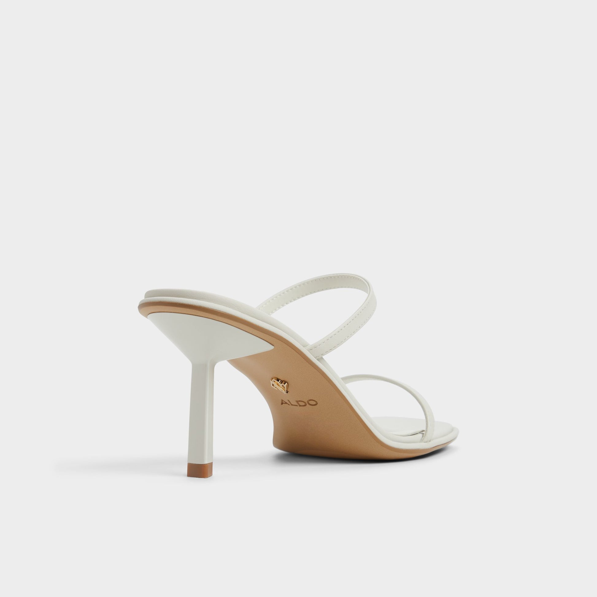 Three-quarter angle of White/Bone Calalden Strappy heeled sandal's back side