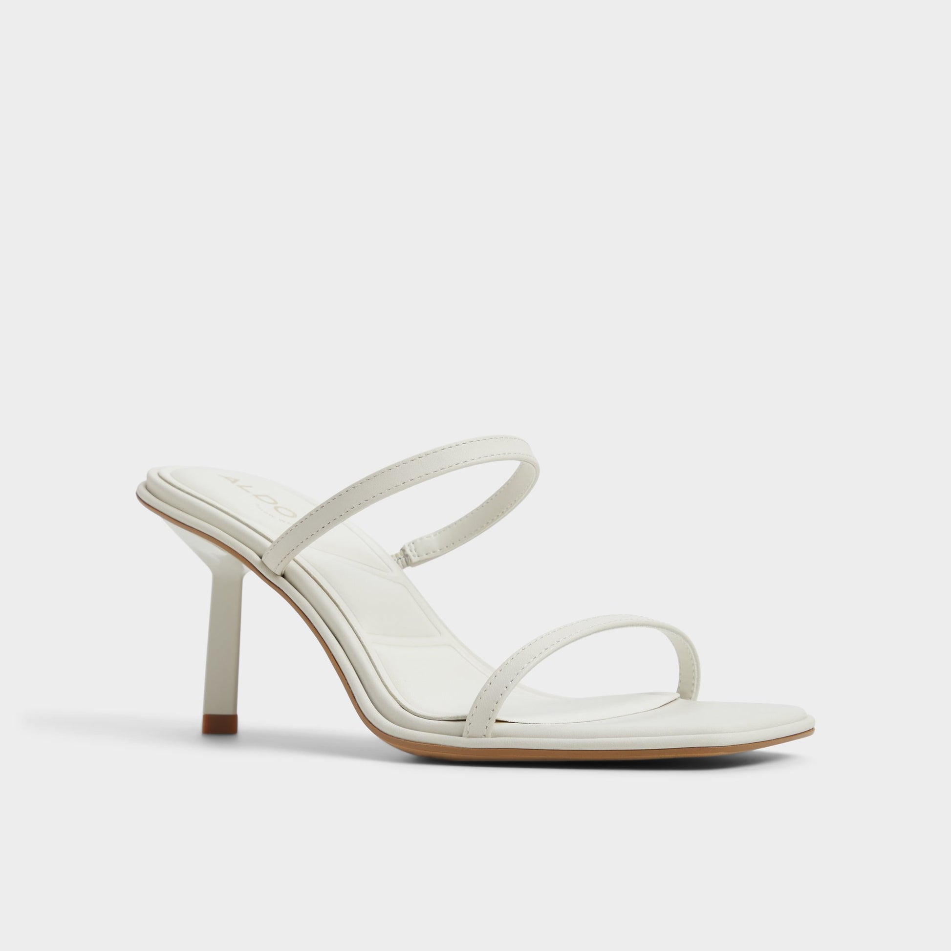 Three-quarter angle of White/Bone Calalden Strappy heeled sandal's front side